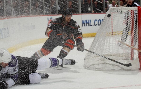 ANAHEIM, CA - APRIL 8:  Luca Sbisa #5 of the Anaheim Ducks chases the puck around the net in a shower of ice against the Los Angeles Kings at Honda Center on April 8, 2011 in Anaheim, California. The Ducks won 2-1 to clinch a berth in the playoffs.  (Phot