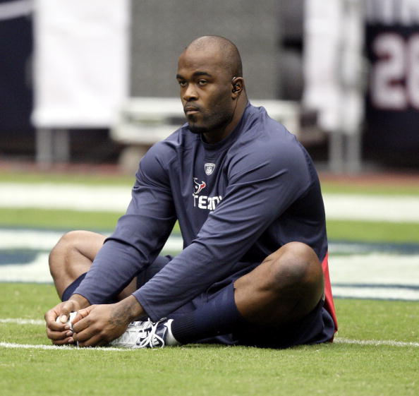 HOUSTON - SEPTEMBER 26:  Defensive end Mario Williams stetches during pre-game warm ups before playing the Dallas Cowboys at Reliant Stadium on September 26, 2010 in Houston, Texas.  (Photo by Bob Levey/Getty Images)