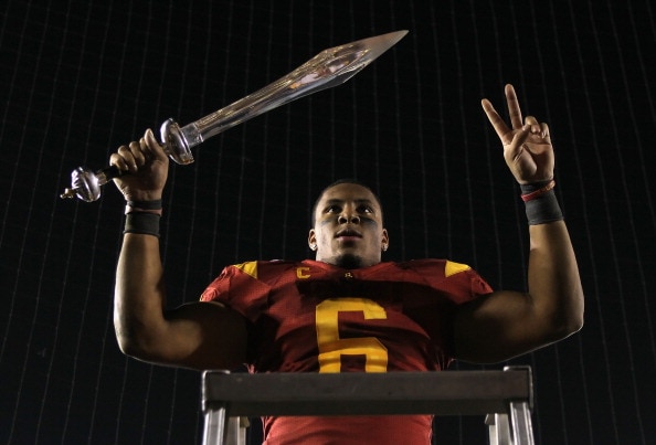 PASADENA, CA - DECEMBER 04:  Malcolm Smith #6 of the USC Trojans celebrates following his teams victory over the UCLA Bruins at the Rose Bowl on December 4, 2010 in Pasadena, California.  USC defeated UCLA 28-14.  (Photo by Jeff Gross/Getty Images)