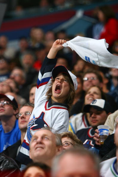 VANCOUVER, BC - APRIL 13:  A young Vancouver Canucks fan cheers during the game against the Dallas Stars during game two of the 2007 Western Conference Quarterfinals on April 13, 2007 at General Motors Place in Vancouver, British Columbia, Canada. The Sta