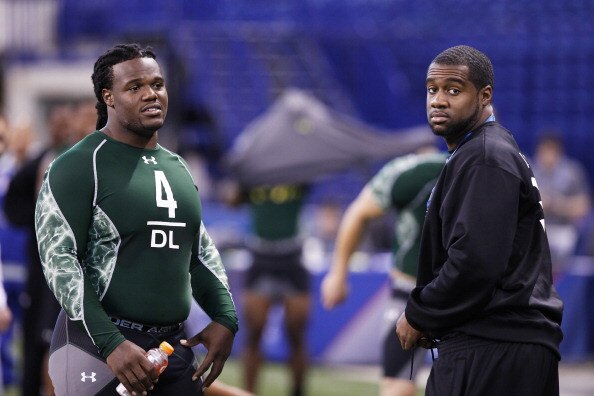 INDIANAPOLIS, IN - FEBRUARY 28: Former North Carolina teammates Marvin Austin (L) and Bruce Carter look on during the 2011 NFL Scouting Combine at Lucas Oil Stadium on February 28, 2011 in Indianapolis, Indiana. (Photo by Joe Robbins/Getty Images)