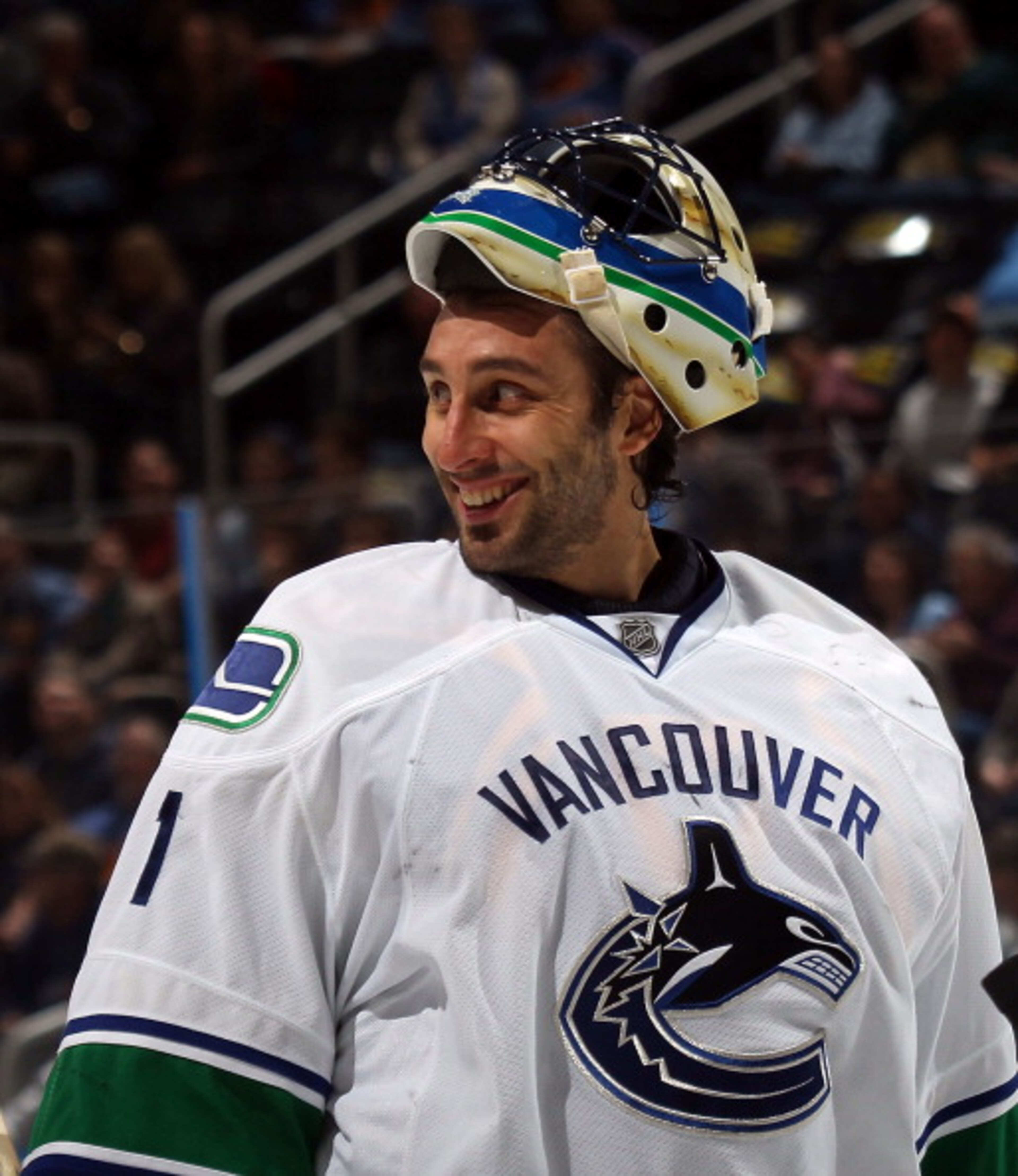 ATLANTA, GA - MARCH 25: Roberto Luongo #1 of the Vancouver Canucks responds to a comment by Dustin Byfuglien #33 of the Atlanta Thrashers during a timeout at the Philips Arena on March 25, 2011 in Atlanta, Georgia.  (Photo by Bruce Bennett/Getty Images)