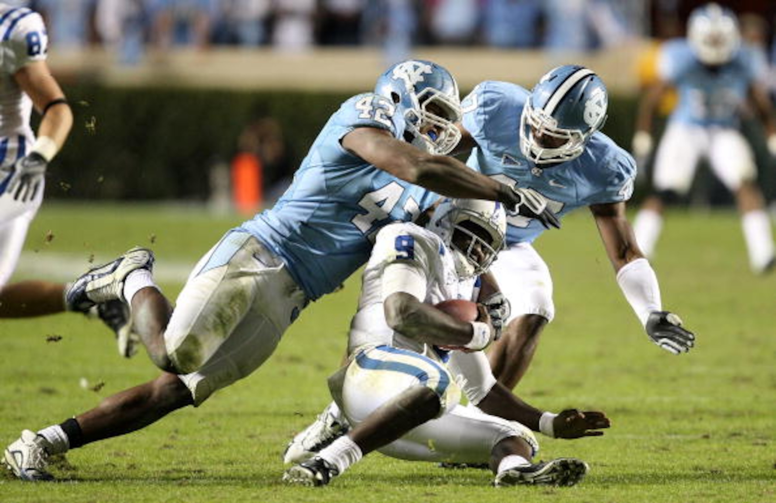 CHAPEL HILL, NC - NOVEMBER 07: Thaddeus Lewis #9 of the Duke Blue Devils is sacked by Robert Quinn #42 of the North Carolina Tar Heels during their game at Kenan Stadium on November 7, 2009 in Chapel Hill, North Carolina. (Photo by Streeter Lecka/Getty CHAPEL HILL, NC - NOVEMBER 07: Thaddeus Lewis #9 of the Duke Blue Devils is sacked by Robert Quinn #42 of the North Carolina Tar Heels during their game at Kenan Stadium on November 7, 2009 in Chapel Hill, North Carolina. (Photo by Streeter Lecka/Getty