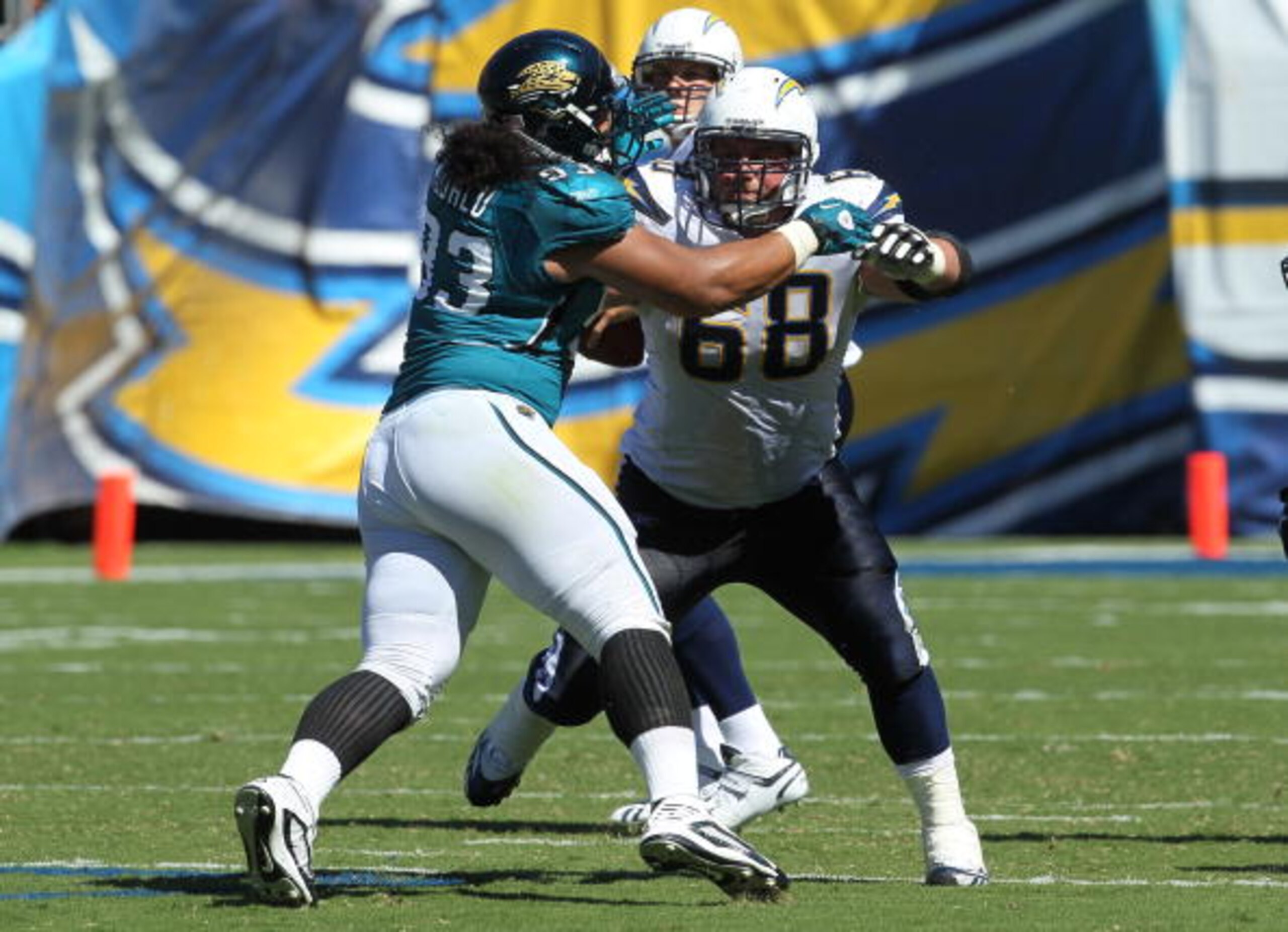 SAN DIEGO - SEPTEMBER 19: Guard Kris Dielman #68 of the San Diego Chargers blocks against defensive tackle Tyson Alualu #93 of the Jacksonville Jaguars at Qualcomm Stadium on September 19, 2010 in San Diego, California. The Chargers won 38-13. (Photo SAN DIEGO - SEPTEMBER 19: Guard Kris Dielman #68 of the San Diego Chargers blocks against defensive tackle Tyson Alualu #93 of the Jacksonville Jaguars at Qualcomm Stadium on September 19, 2010 in San Diego, California. The Chargers won 38-13. (Photo