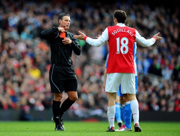 LONDON, ENGLAND - JANUARY 30:  Sebastien Squillaci #30 of Arsenal reacts as he is shown a straight red card by Referee Mark Clattenburg after his foul on Jack Hunt of Huddersfield during the FA Cup sponsored by E.ON fourth round match between Arsenal and