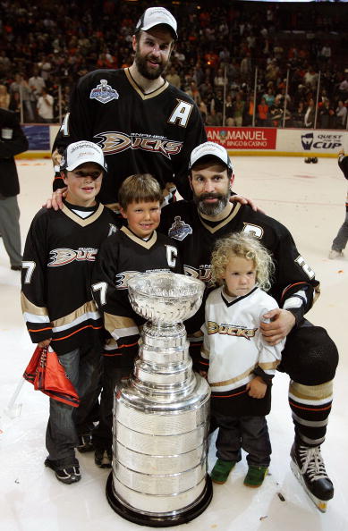 ANAHEIM, CA - JUNE 06:  Rob Niedermayer #44 of the Anaheim Ducks and brother Scott Niedermayer #27 pose with Scott's sons Logan, Jackson and Josh and the Stanley Cup after their team's victory over the Ottawa Senators in Game Five of the n June 6, 2007 at