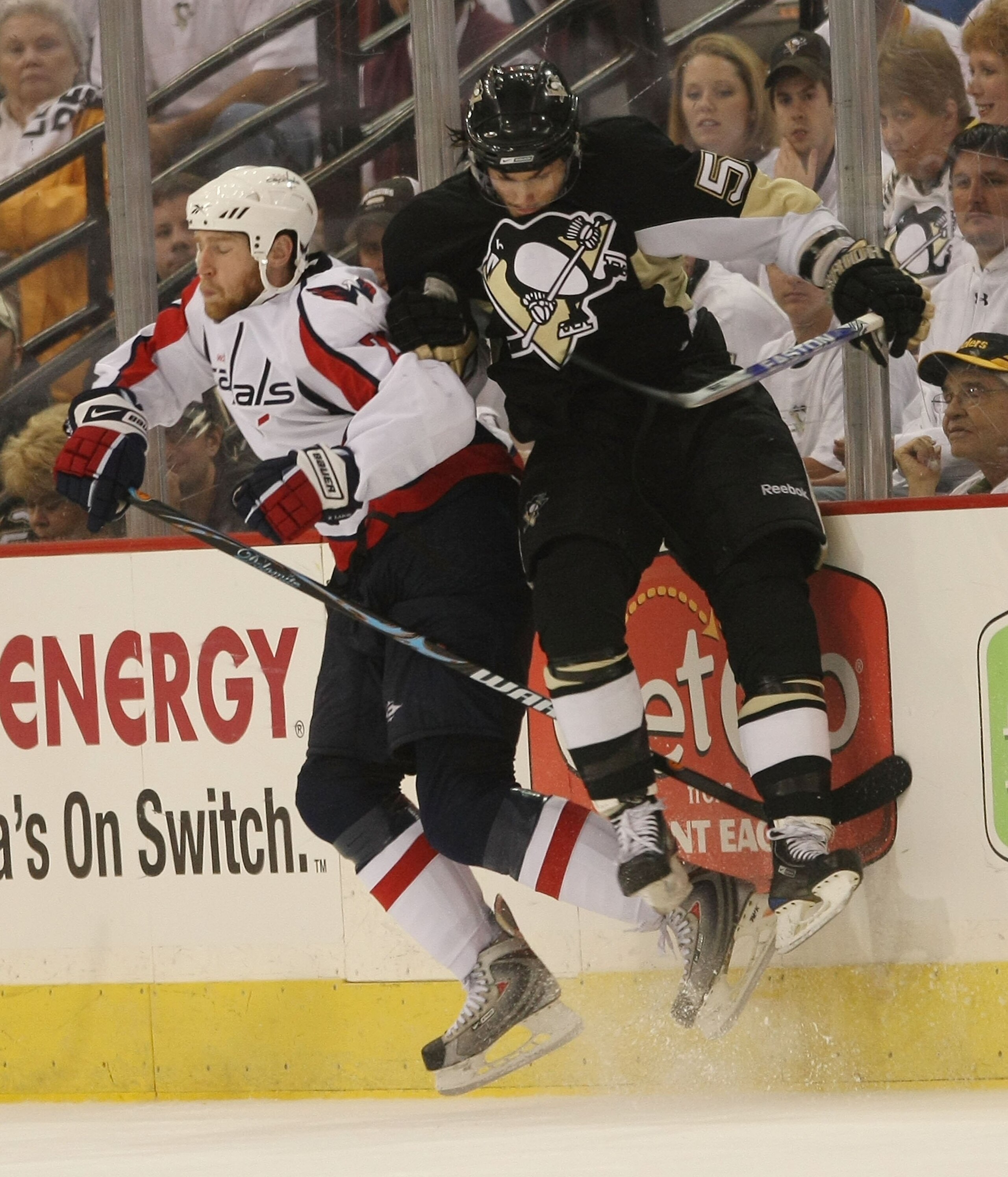 PITTSBURGH - MAY 11:  Brooks Laich #21 of the Washington Capitals sidesteps a hit by Kris Letang #58 of the Pittsburgh Penguins during Game Six of the Eastern Conference Semifinal Round of the 2009 Stanley Cup Playoffs at Mellon Arena on May 11, 2009 in P