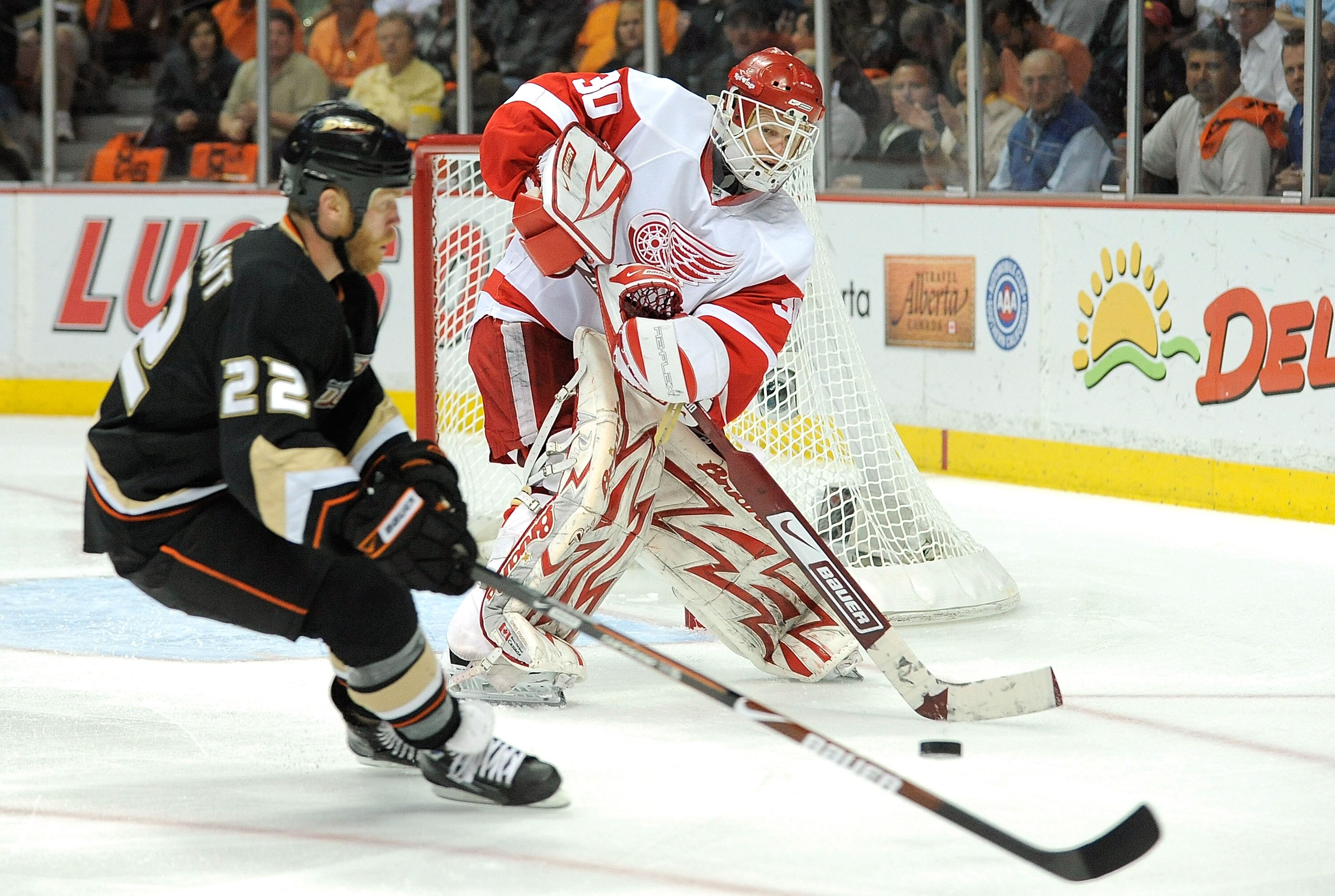 ANAHEIM, CA - MAY 05:  Goaltender Chris Osgood #30 of the Detroit Red Wings defends the goal against Todd Marchant #22 of the Anaheim Ducks in the first period of Game Three of the Western Conference Semifinal Round of the 2009 Stanley Cup Playoffs at the