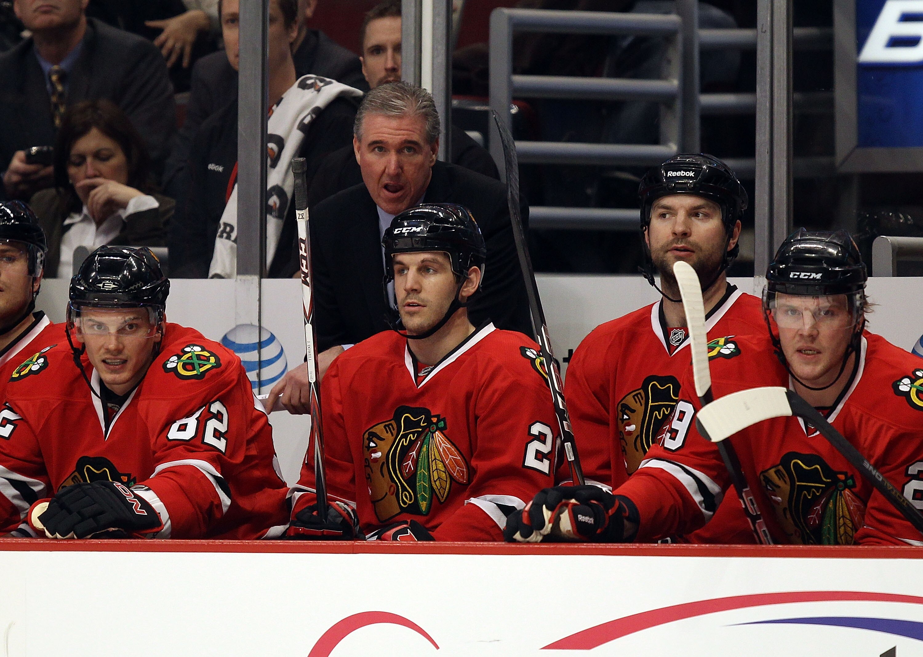 CHICAGO, IL - FEBRUARY 16: Assistant coach Mike Haviland of the Chicago Blackhawks, acting as head coach in place of Joel Quenneville, who is ill, watches the action with players including Tomas Kopecky #82 and Jake Dowell #28 against the Minnesota Wild a