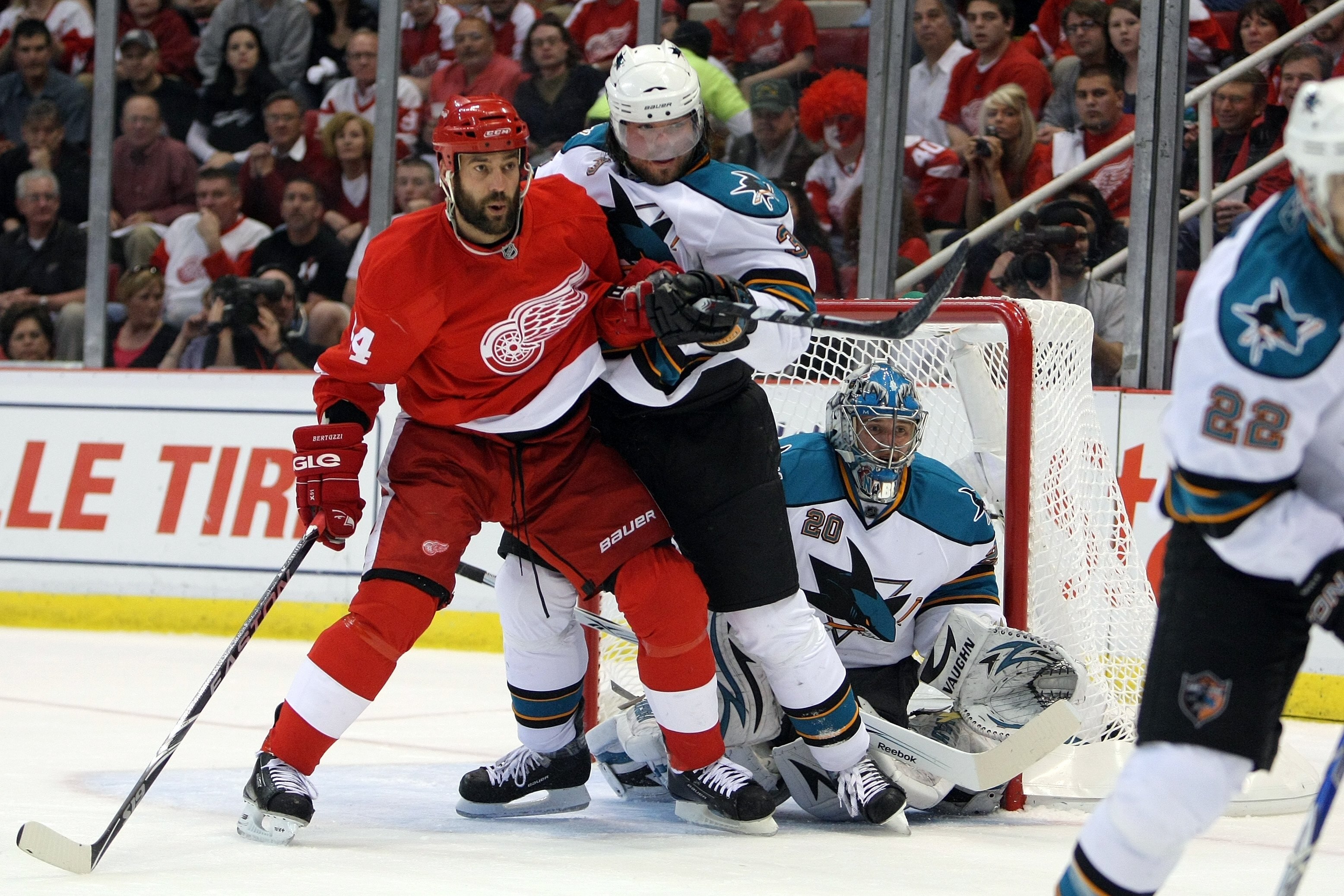 DETROIT - MAY 4:  Douglas Murray #3 and Evgeni Nabokov #20 of the San Jose Sharks defend against Todd Bertuzzi #44 of the Detroit Red Wings in Game Three of the Western Conference Semifinals during the 2010 Stanley Cup Playoffs at Joe Louis Arena on May 4