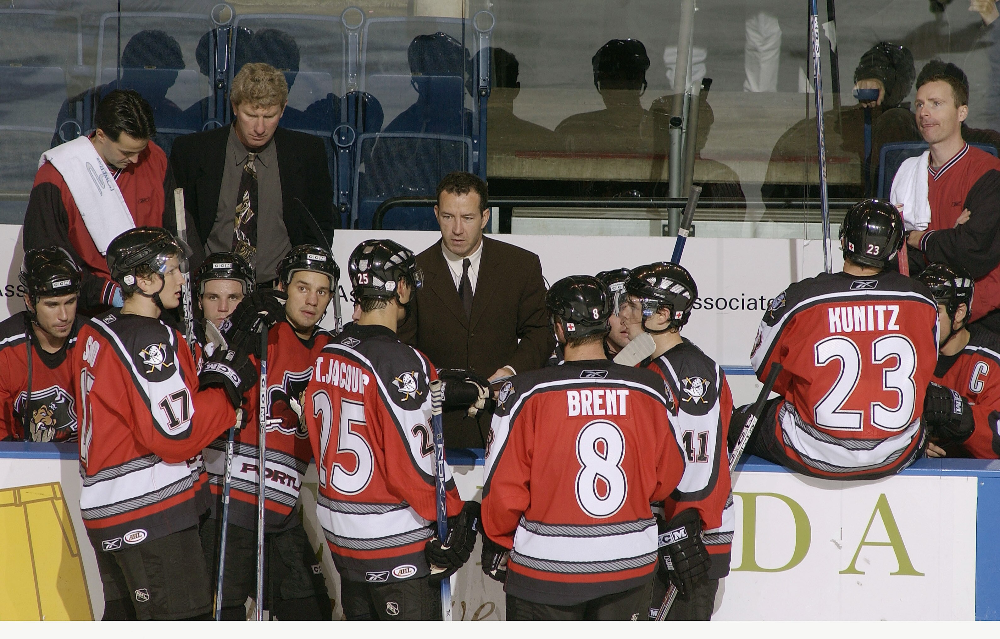 BRIDGEPORT, CT - OCTOBER 22:  Head coach Kevin Dineen of the Portland Pirates talks to players at the bench during a break in the game against the Bridgeport Sound Tigers at the Arena at Harbor Yard on October 22, 2005 in Bridgeport, Connecticut.  The Pir