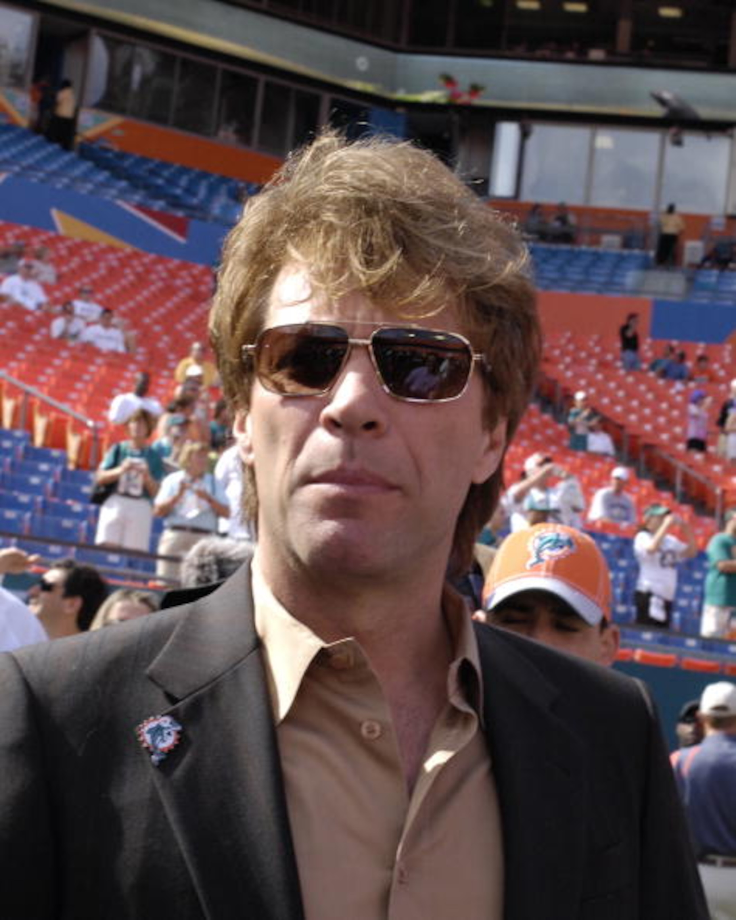 MIAMI, FL - JANUARY 4: Singer Jon Bon Jovi watches warmups as the Miami Dolphins host the Baltimore Ravens in an NFL Wildcard Playoff Game at Dolphins Stadium on January 4, 2009 in Miami, Florida. (Photo by Al Messerschmidt/Getty Images) MIAMI, FL - JANUARY 4: Singer Jon Bon Jovi watches warmups as the Miami Dolphins host the Baltimore Ravens in an NFL Wildcard Playoff Game at Dolphins Stadium on January 4, 2009 in Miami, Florida. (Photo by Al Messerschmidt/Getty Images)