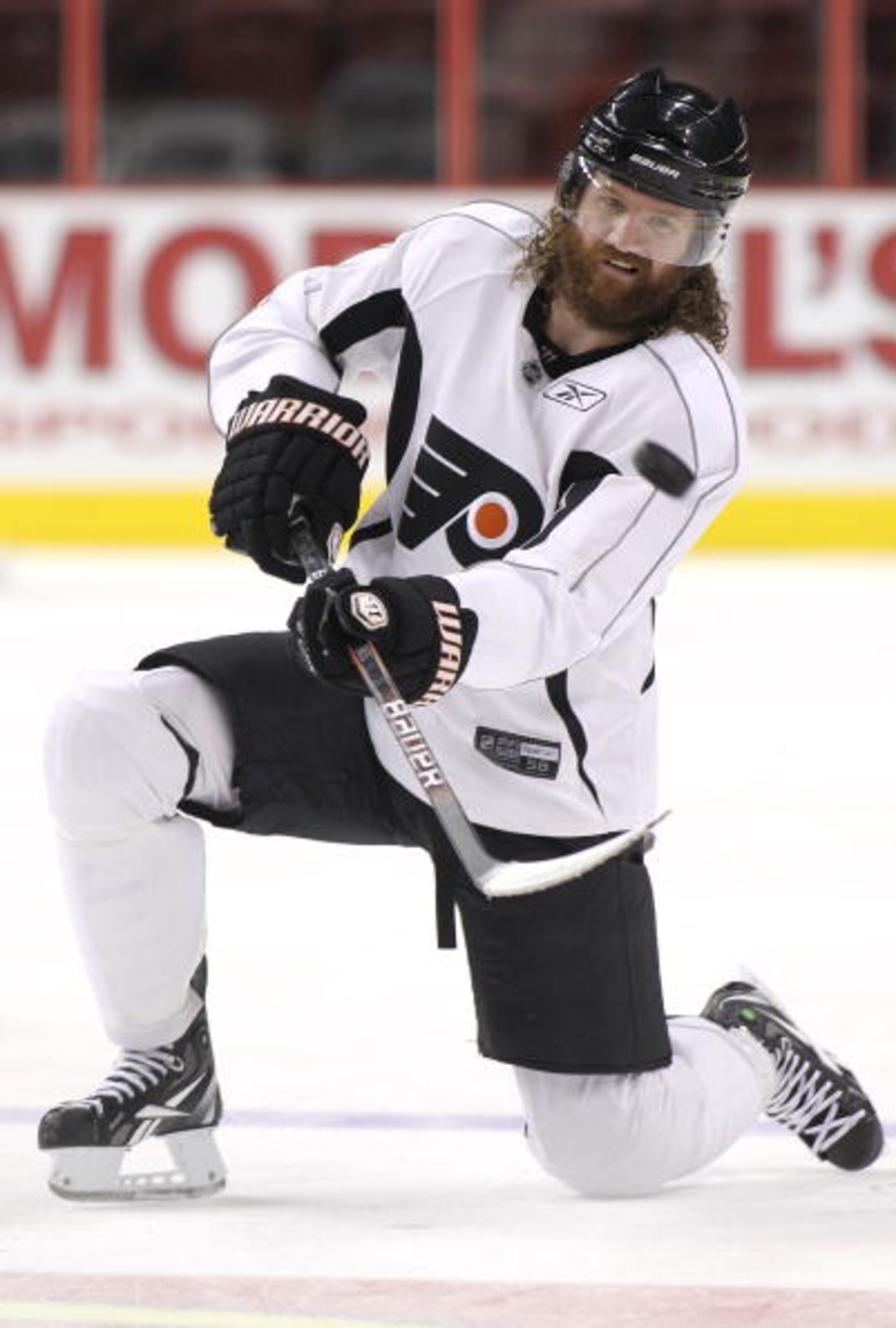 PHILADELPHIA - JUNE 8:  Scott Hartnell #19 of the Philadelphia Flyers flips a puck from a kneeling position during practice for the 2010 NHL Stanley Cup Final at Wachovia Center on June 8, 2010 in Philadelphia, Pennsylvania.  (Photo by Andre Ringuette/Get