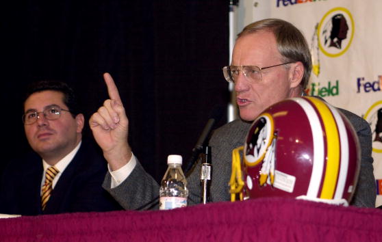 4 Jan 2001:  New head coach Marty Schottenheimer of the Washington Redskins fields questions from the media as team owner Daniel Snyder (left) look on during a press conference to announce the signing of Schottenheimer's four-year ten million dollar contr