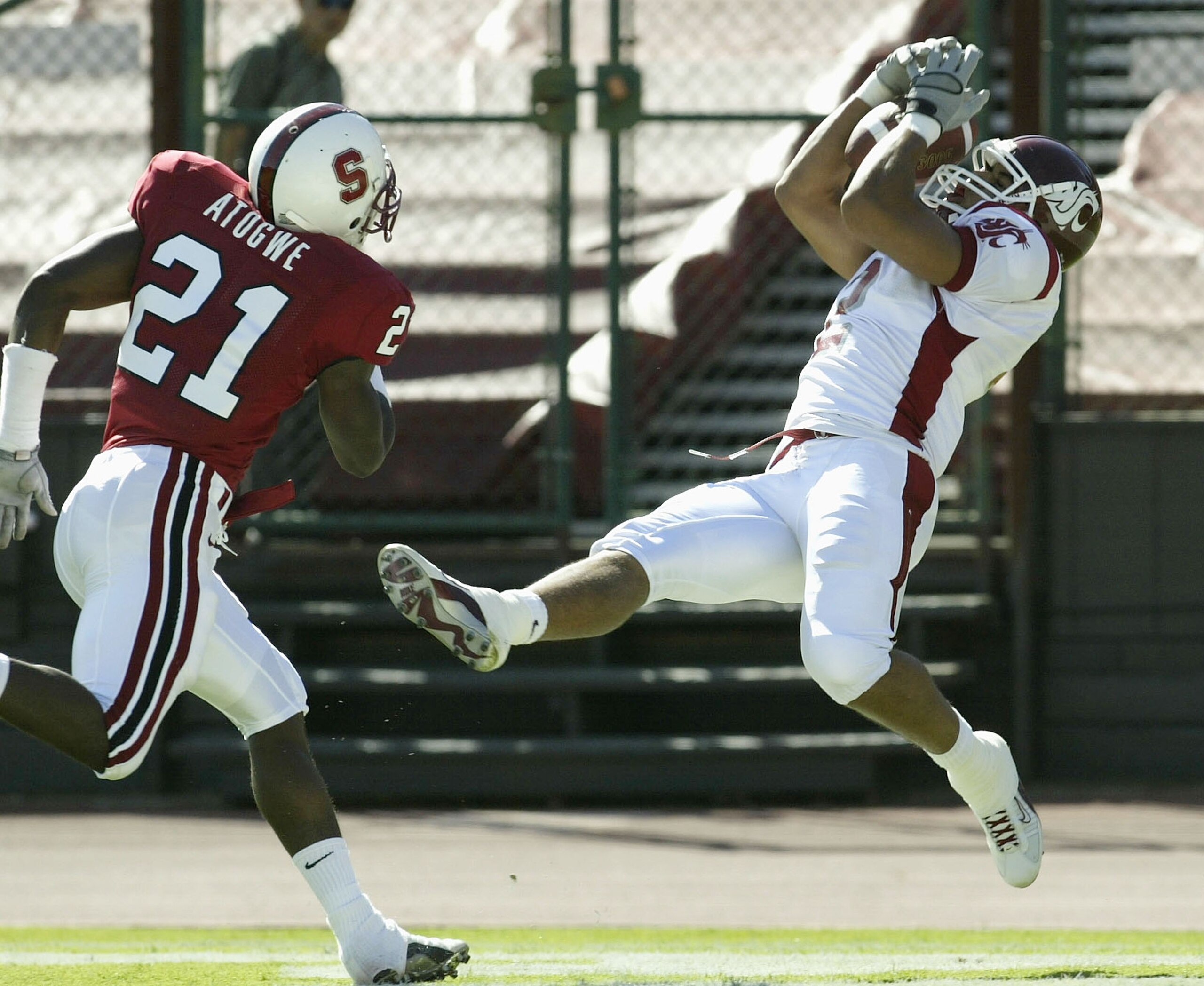 PALO ALTO, CA  - OCTOBER 18:  Wide receiver Chris Jordan #2 of the Washington State Cougars makes a touchdown catch on the game's first series as safety Oshiomogho Atogwe #21 of the Stanford Cardinal defends on October 18, 2003 at Stanford Stadium in Palo