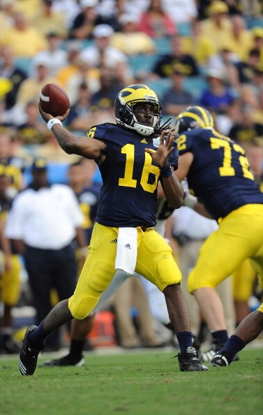 JACKSONVILLE, FL - JANUARY 01:  Quarterback Denard Robinson #16 of the Michigan Wolverines passes against the Mississippi State Bulldogs during the Gator Bowl at EverBank Field on January 1, 2011 in Jacksonville, Florida  (Photo by Rick Dole/Getty Images)
