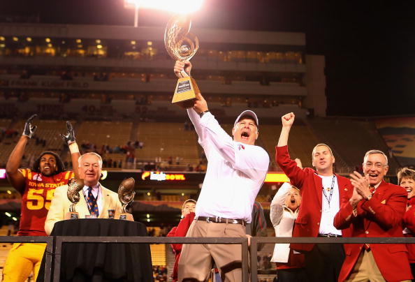 TEMPE, AZ - DECEMBER 31:  Head coach Paul Rhoads of the Iowa State Cyclones celebrates with the Insight Bowl trophy after defeating the Minnesota Golden Gophers at Arizona Stadium on December 31, 2009 in Tempe, Arizona.  The Cyclones defeated the Golden G