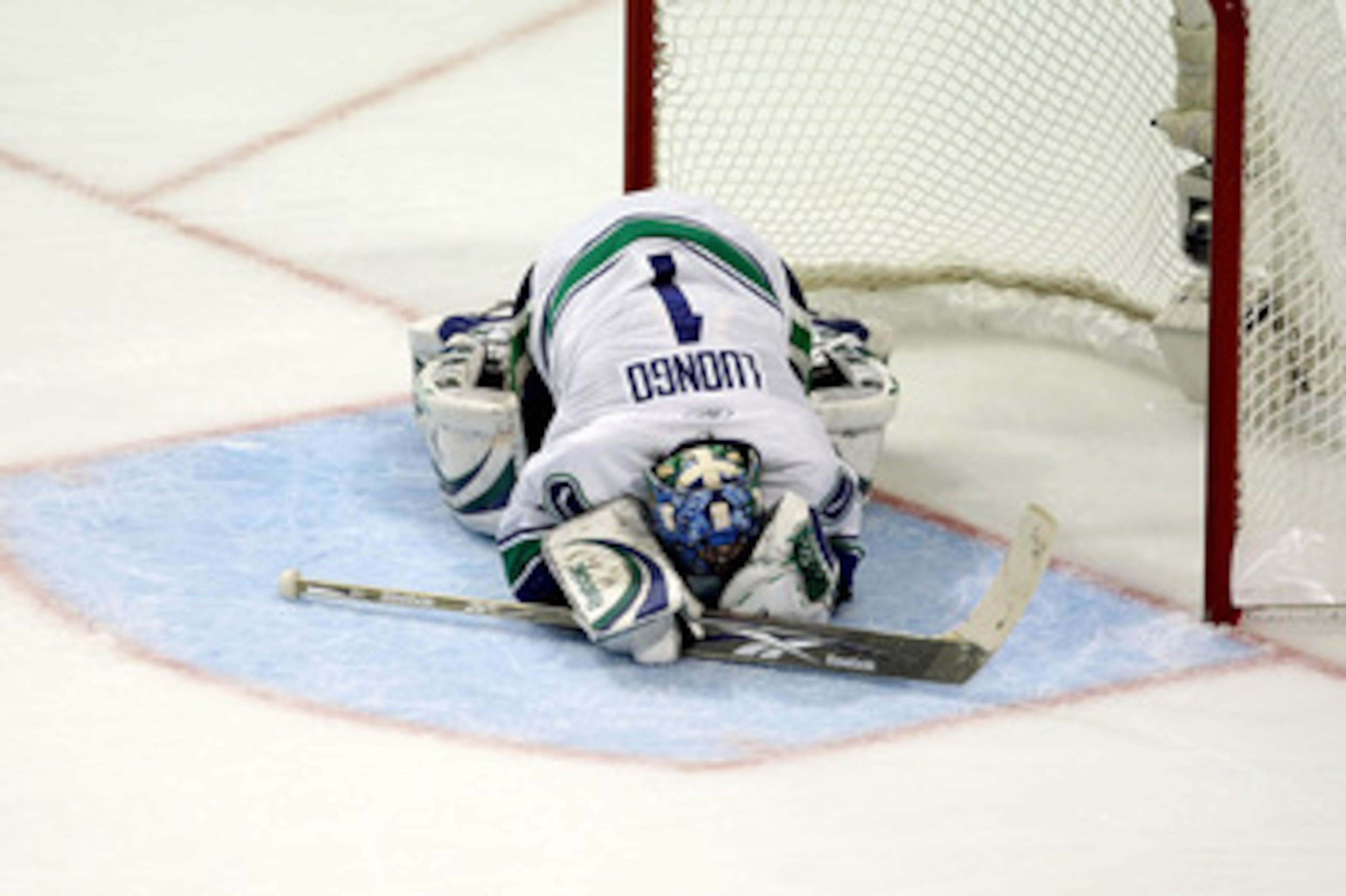 CHICAGO - MAY 07:  Goalie Roberto Luongo #1 of the Vancouver Canucks lies face down on the ice against the Chicago Blackhawks during Game Four of the Western Conference Semifinal Round of the 2009 Stanley Cup Playoffs on May 7, 2009 at the United Center i