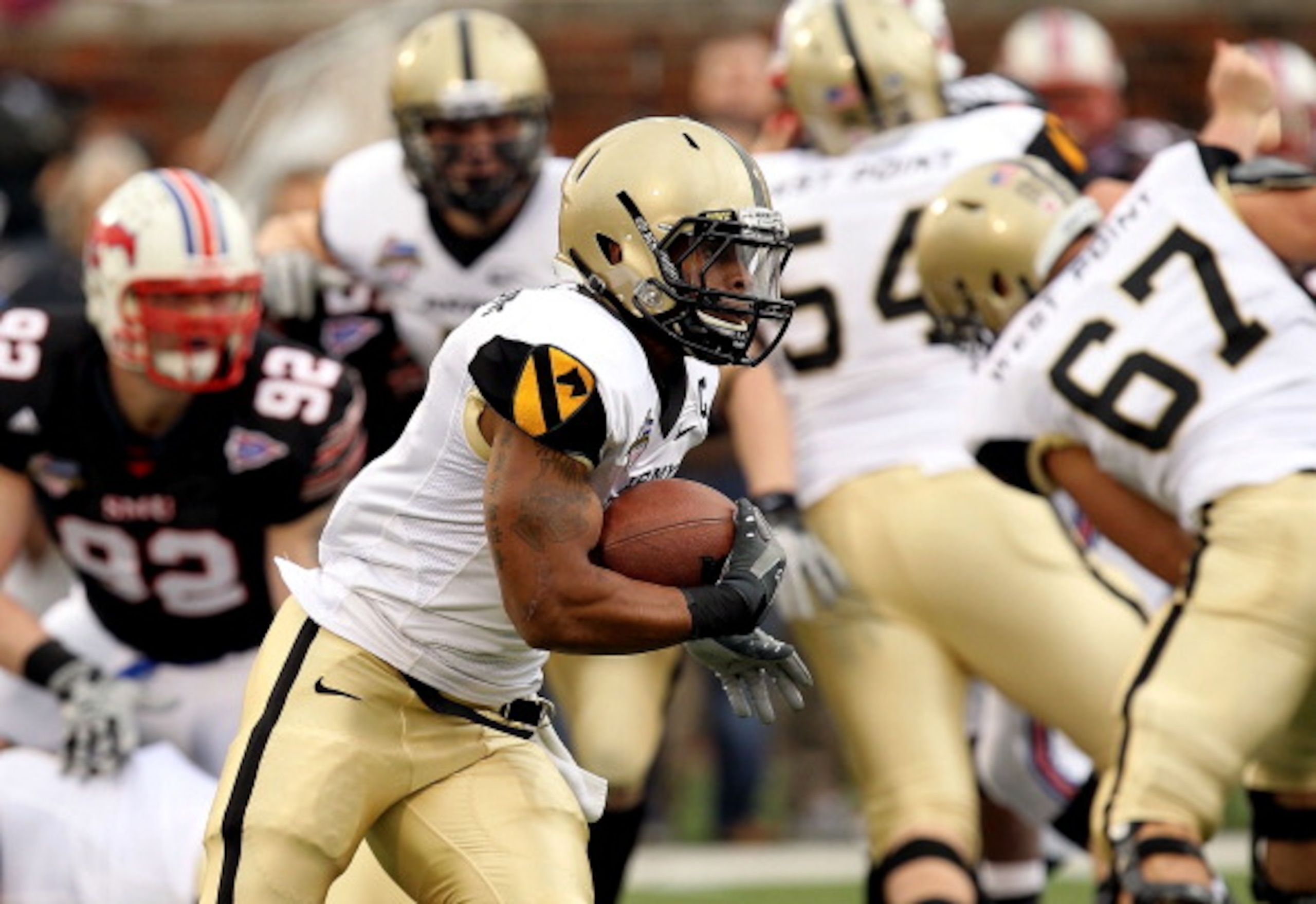 DALLAS, TX - DECEMBER 30:  Running back Patrick Mealy #5 of the Army Black Knights runs the ball against the SMU Mustanges during the Bell Helicopter Armed Forces Bowl at Gerald J. Ford Stadium on December 30, 2010 in Dallas, Texas.  (Photo by Ronald Mart