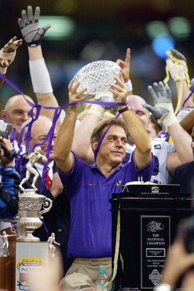 NEW ORLEANS - JANUARY 4:  Head coach Nick Saban of the Louisiana State Tigers lifts the Bowl Championship Series National Championship Trophy after his team defeated the Oklahoma Sooners in the Nokia Sugar Bowl National Championship on January 4, 2004 at