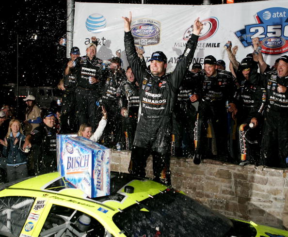WEST ALLIS, WI - JUNE 24:  Paul Menard and his crew celebrate victory at the AT&T 250 race with a beer shower on June 24, 2006 at the Milwaukee Mile in West Allis, Wisconsin.  (Photo by Jonathan Daniel/Getty Images)