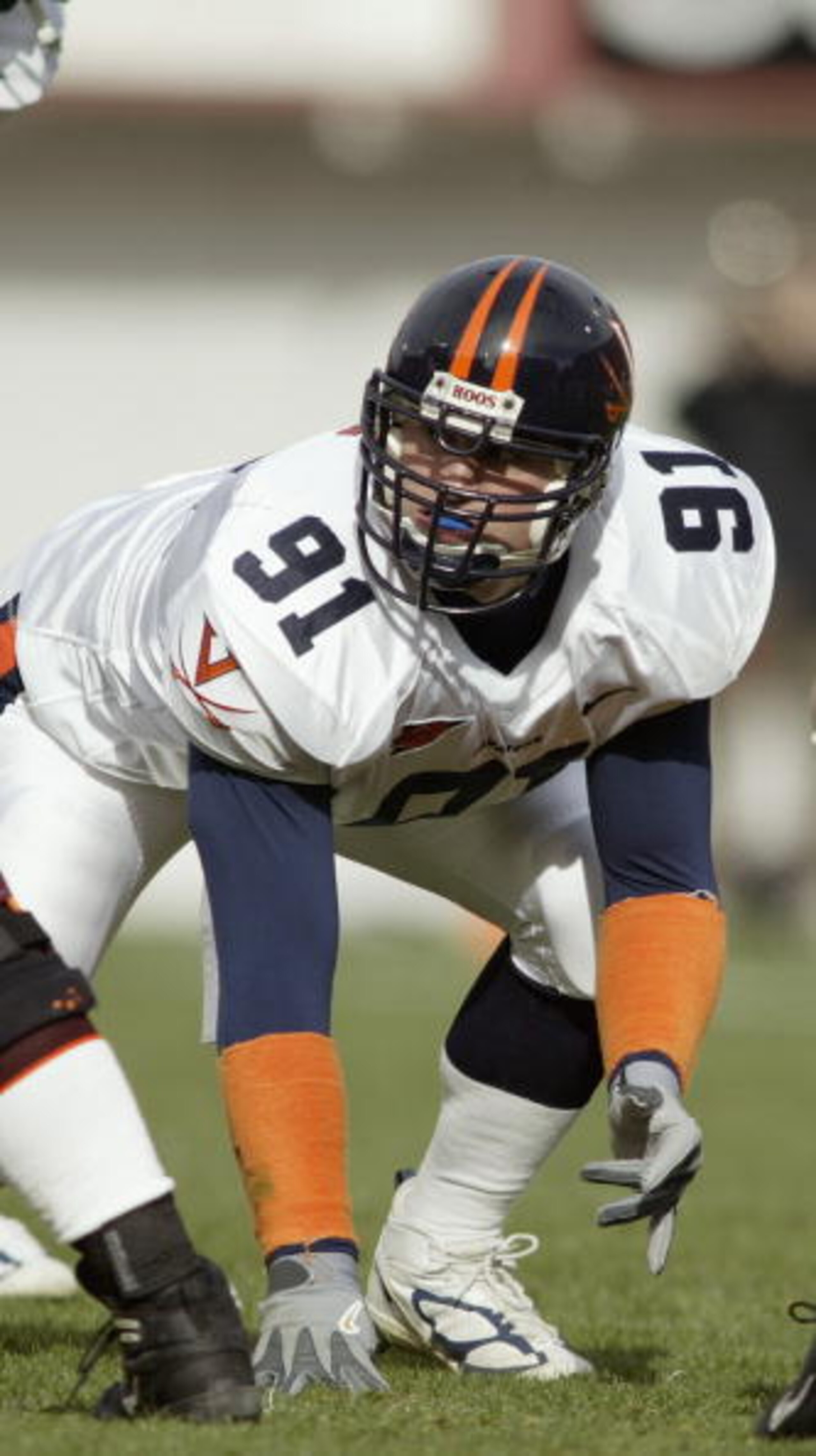 BLACKSBURG, VA - NOVEMBER 27:  Defensive lineman Chris Long #91 of the Virginia Cavaliers lines up against the Virginia Tech Hokies on November 27, 2004 at Lane Stadium in Blacksburg, Virginia. Virginia Tech defeated Virginia 24-10. (Photo By Grant Halver