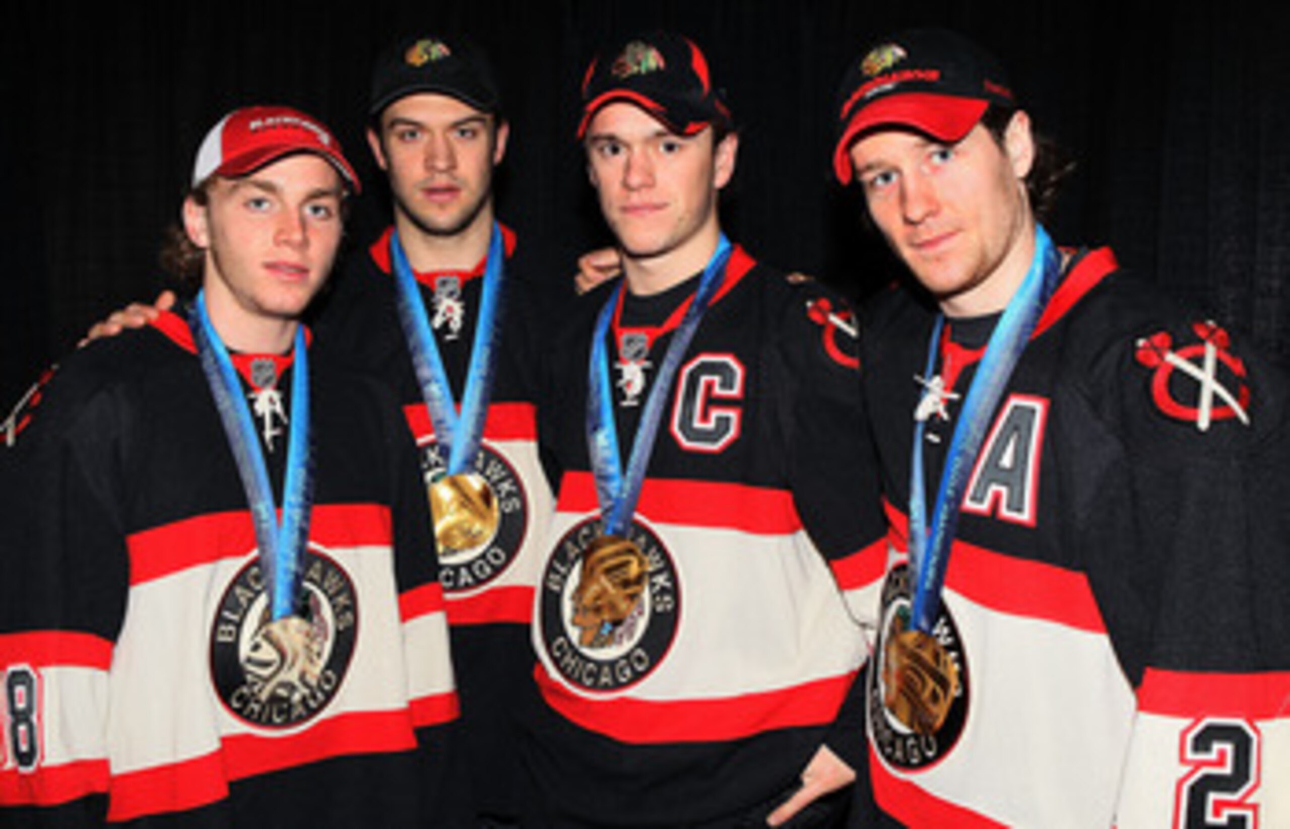 UNIONDALE, NY - MARCH 02:  (L-R) Chicago Blackhawks Olympic medal winners Patrick Kane of the Untited States, Brent Seabrook, Jonathan Toews, and Duncan Keith of Canada pose for a photo prior to playing the New York Islanders on March 2, 2010 at Nassau Co