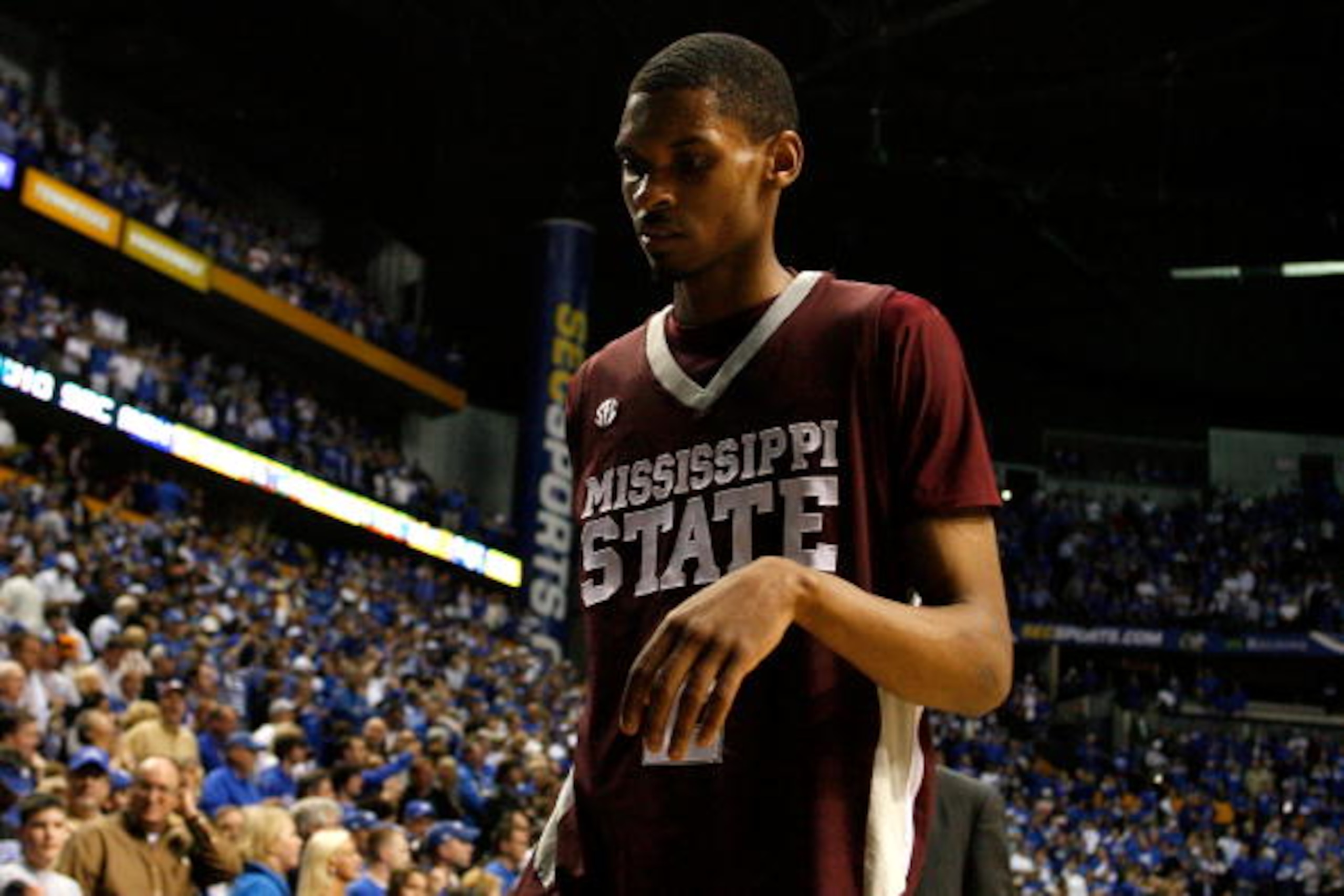 NASHVILLE, TN - MARCH 14:  Ravern Johnson #2 of the Mississippi State Bulldogs walks off the court dejected after Mississippi lost 75-74 in overtime against the Kentucky Wildcats during the final of the SEC Men's Basketball Tournament at the Bridgestone A
