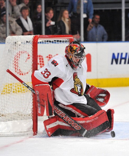 NEW YORK, NY - DECEMBER 5: Pascal Leclaire #33 of the Ottawa Senators deflects a shot on goal during the second period against the New York Rangers at Madison Square Garden on December 5, 2010 in New York City. (Photo by Christopher Pasatieri/Getty Images