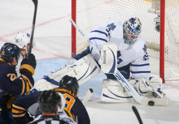BUFFALO, NY - FEBRUARY 16: Jean-Sebastien Giguere #35 of the Toronto Maple Leafs covers up on a shot by Tim Connolly #19 of the Buffalo Sabres  at HSBC Arena on February 16, 2011 in Buffalo, New York.  (Photo by Rick Stewart/Getty Images)