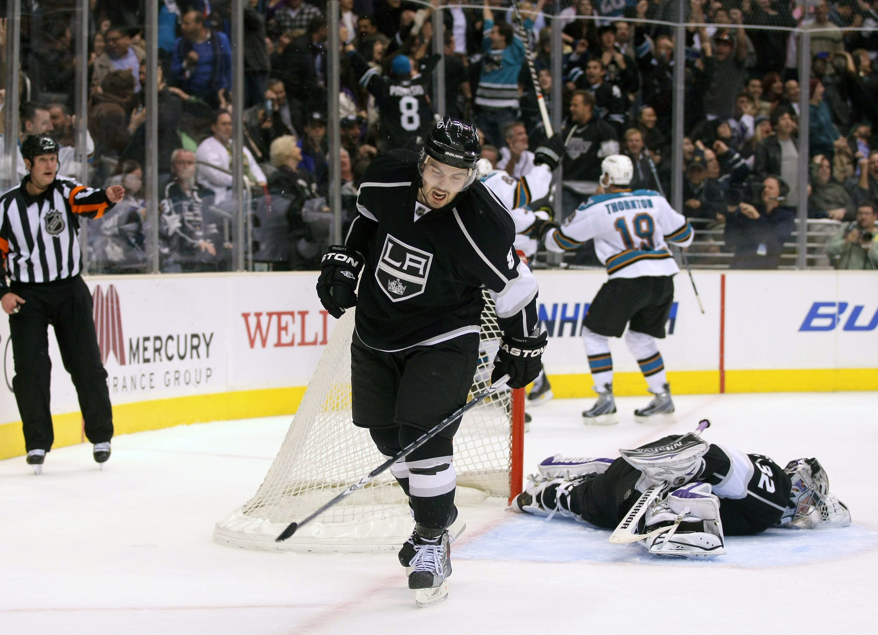 LOS ANGELES, CA - MARCH 24:  Drew Doughty #8 of the Los Angeles Kings reacts after Patrick Marleau #12 of the San Jose Sharks scored with less than five seconds left to tie the game 3-3 in the third period to force overtime during the NHL game at Staples