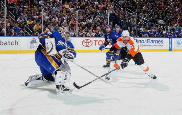 BUFFALO NY - JANUARY 11:  Jeff Carter #17 of the Philadelphia Flyers closes in as Ryan Miller #30 of the Buffalo Sabres clears the puck during their NHL game at HSBC Arena January 11, 2011 in Buffalo, New York. (Photo By Dave Sandford/Getty Images)