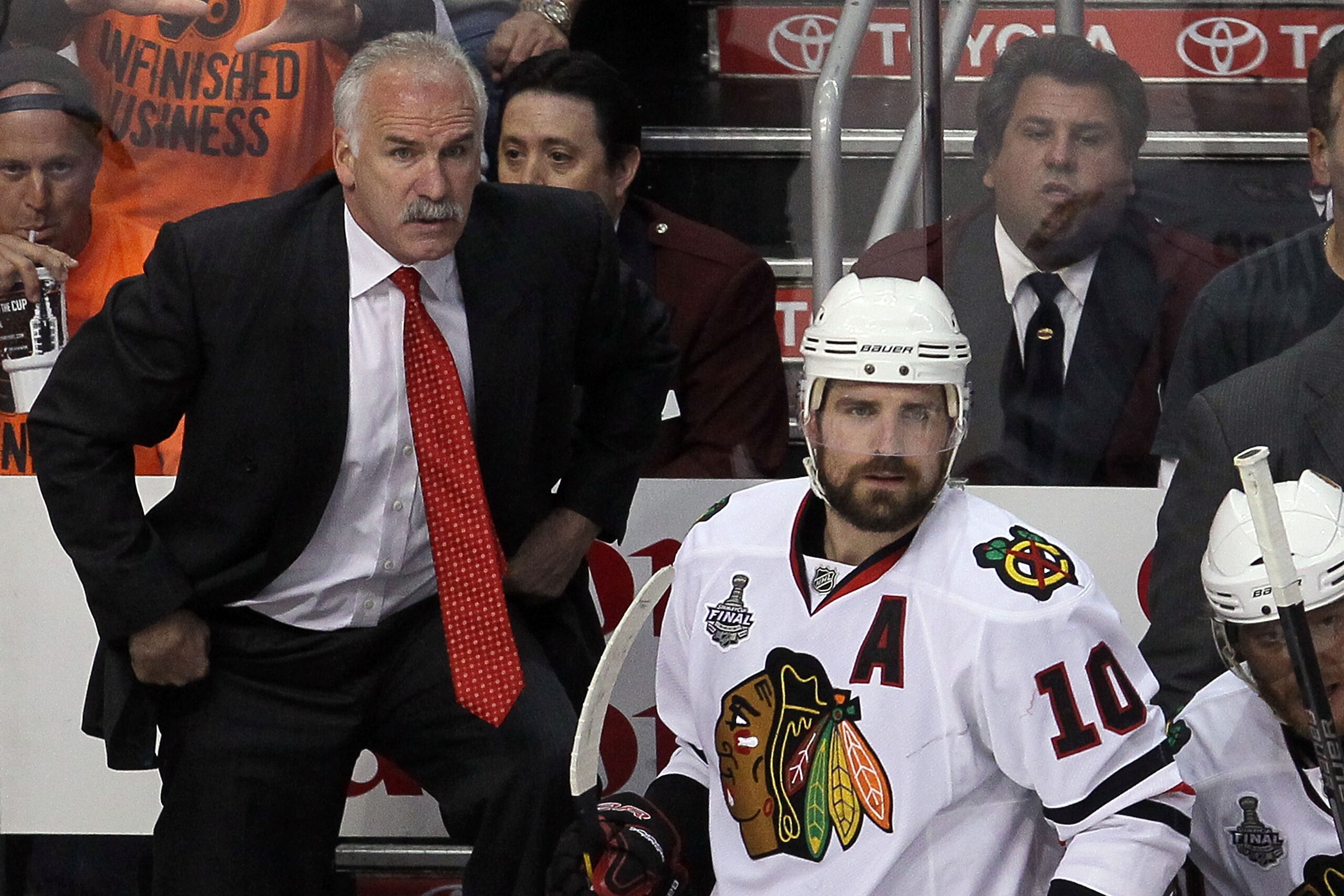 PHILADELPHIA - JUNE 09:  Head coach Joel Quenneville and Patrick Sharp #10 of the Chicago Blackhawks look on from the bench in Game Six of the 2010 NHL Stanley Cup Final against the Philadelphia Flyers at the Wachovia Center on June 9, 2010 in Philadelphi