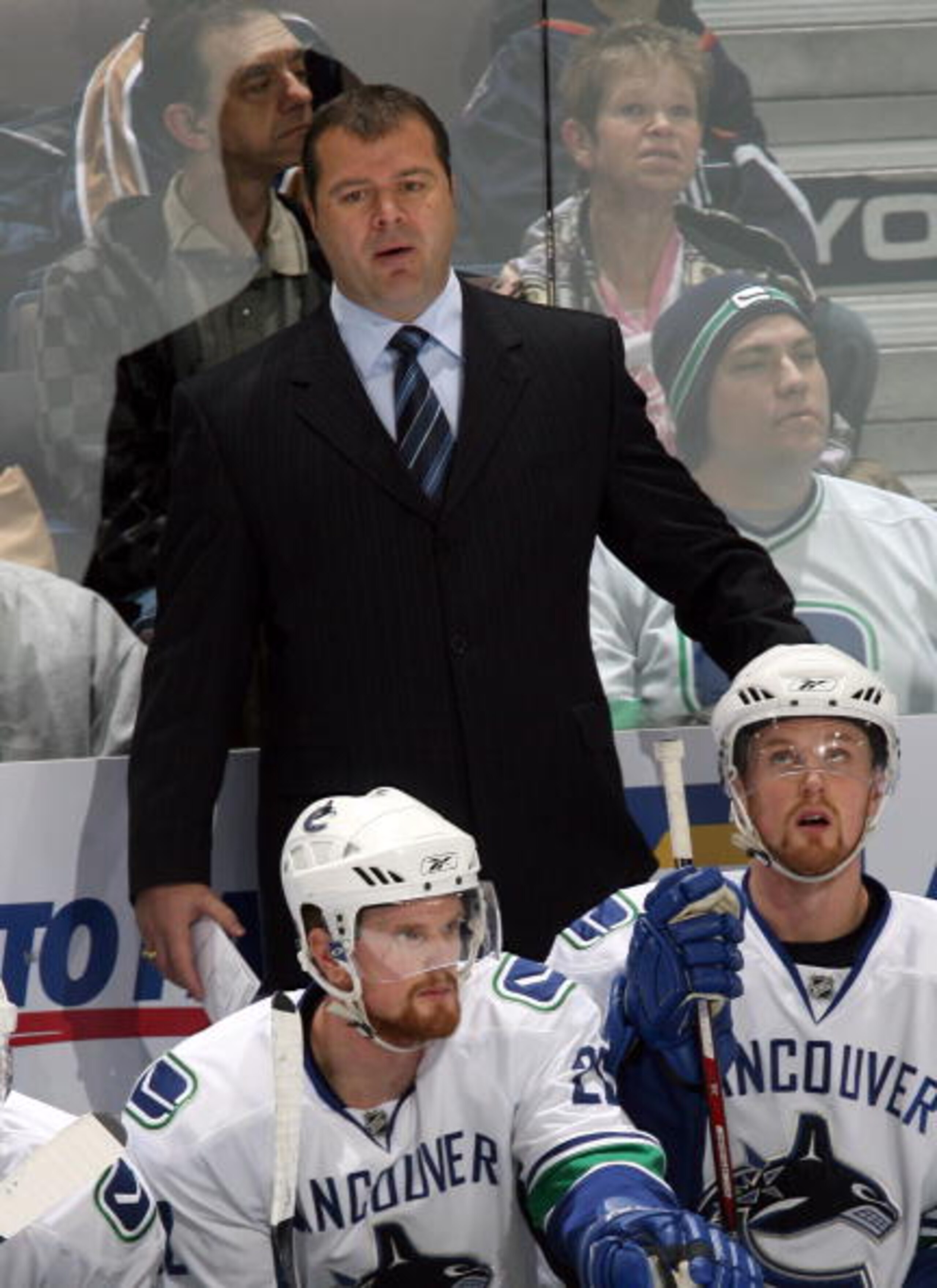 EDMONTON, CANADA - DECEMBER 15:  Head Coach Alain Vigneault of the Vancouver Canucks looks on from the bench area during their NHL game against the Edmonton Oilers on December 15, 2007 in Edmonton, Alberta, Canada.  The Oilers defeated the Canucks 2-1 in