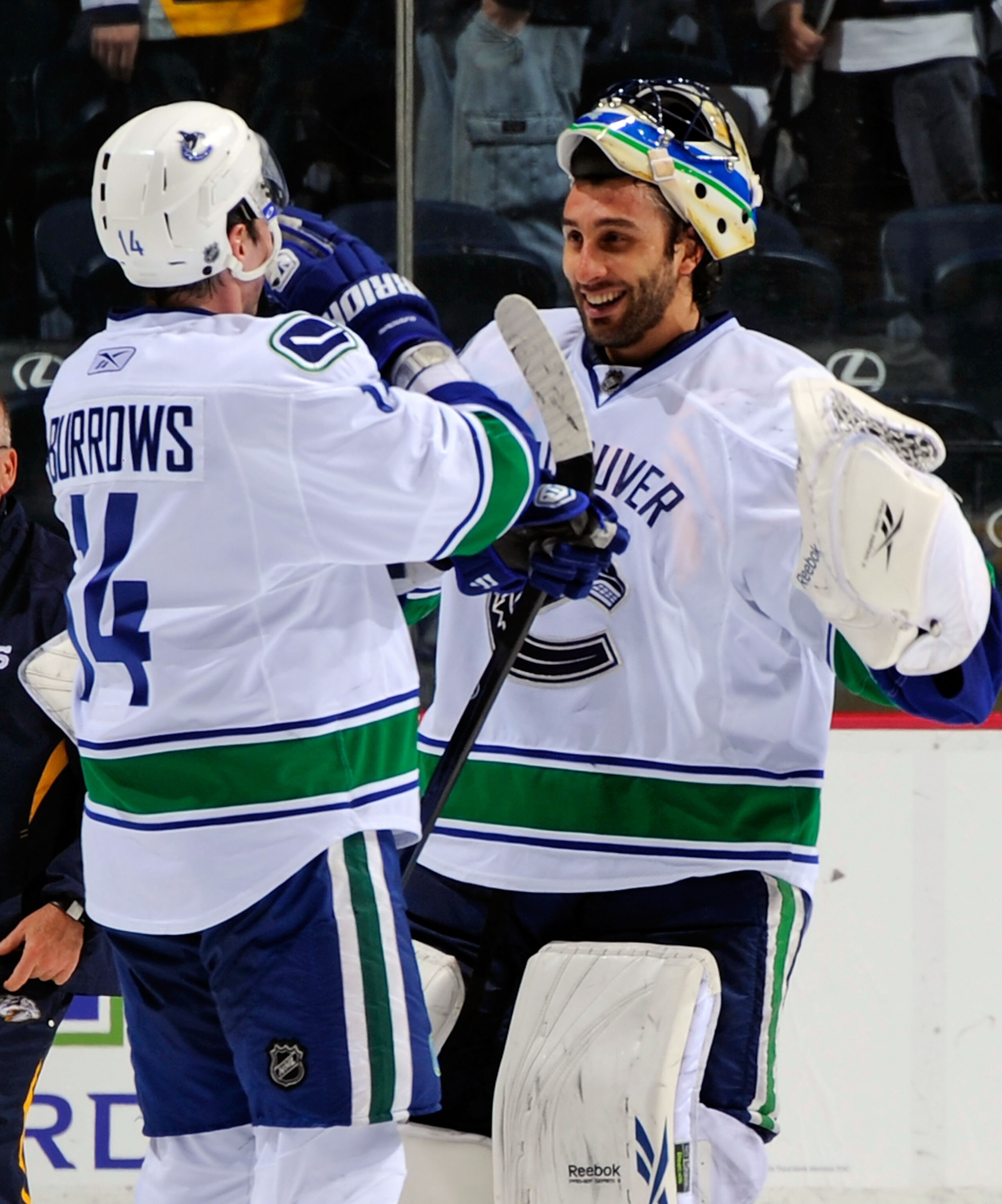 NASHVILLE, TN - MARCH 29: Alexandre Burrows #14 of the Vancouver Canucks congratulates teammate goalie Roberto Luongo #1 on defeating the Nashville Predators on March 29, 2011 at the Bridgestone Arena in Nashville, Tennessee. (Photo by Frederick Breedon NASHVILLE, TN - MARCH 29: Alexandre Burrows #14 of the Vancouver Canucks congratulates teammate goalie Roberto Luongo #1 on defeating the Nashville Predators on March 29, 2011 at the Bridgestone Arena in Nashville, Tennessee. (Photo by Frederick Breedon
