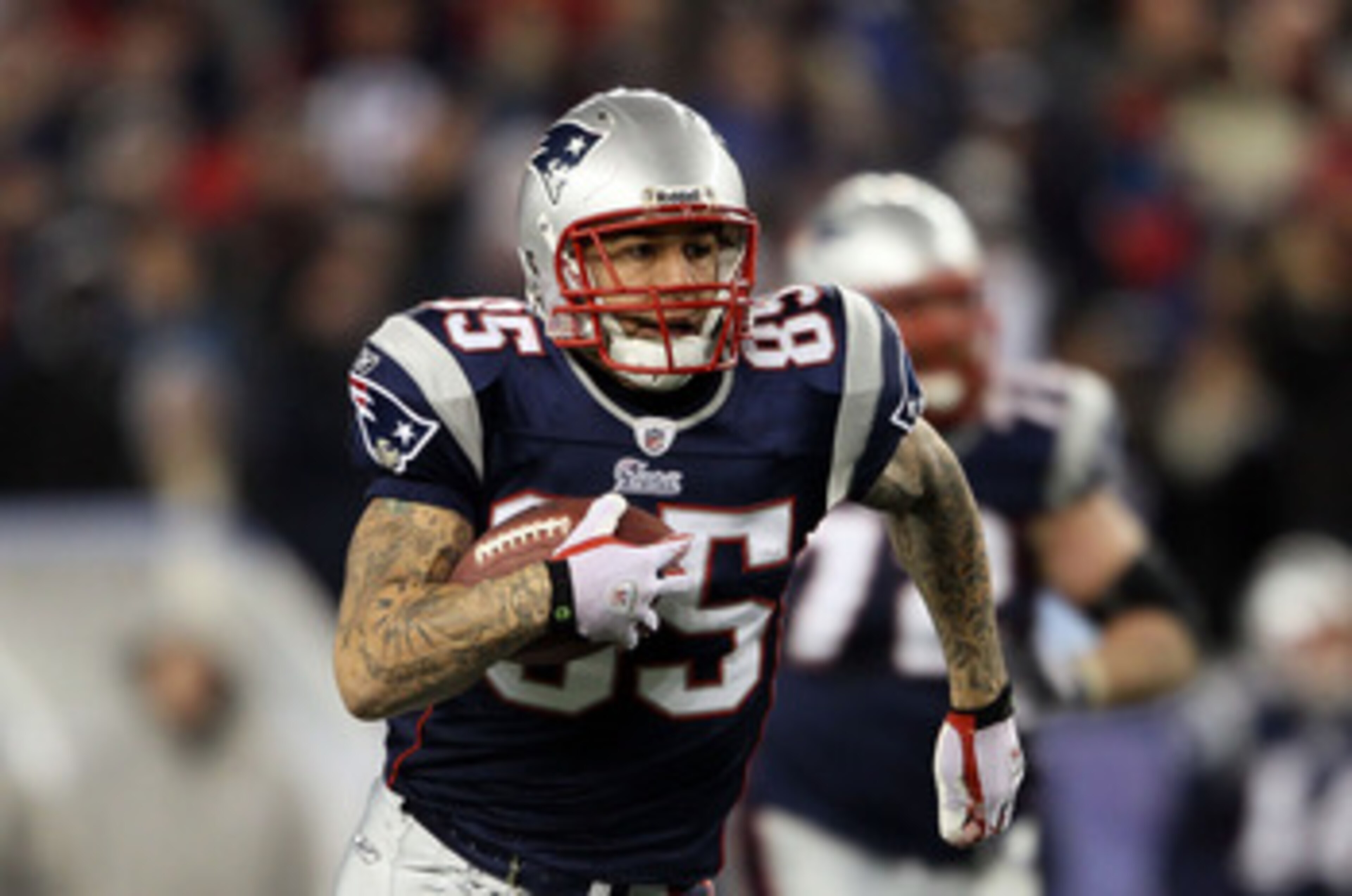 FOXBORO, MA - DECEMBER 06:  Tight end Aaron Hernandez #85 of the New England Patriots runs for yards after the catch against the New York Jets at Gillette Stadium on December 6, 2010 in Foxboro, Massachusetts. The Patriots won 45-3.  (Photo by Elsa/Getty