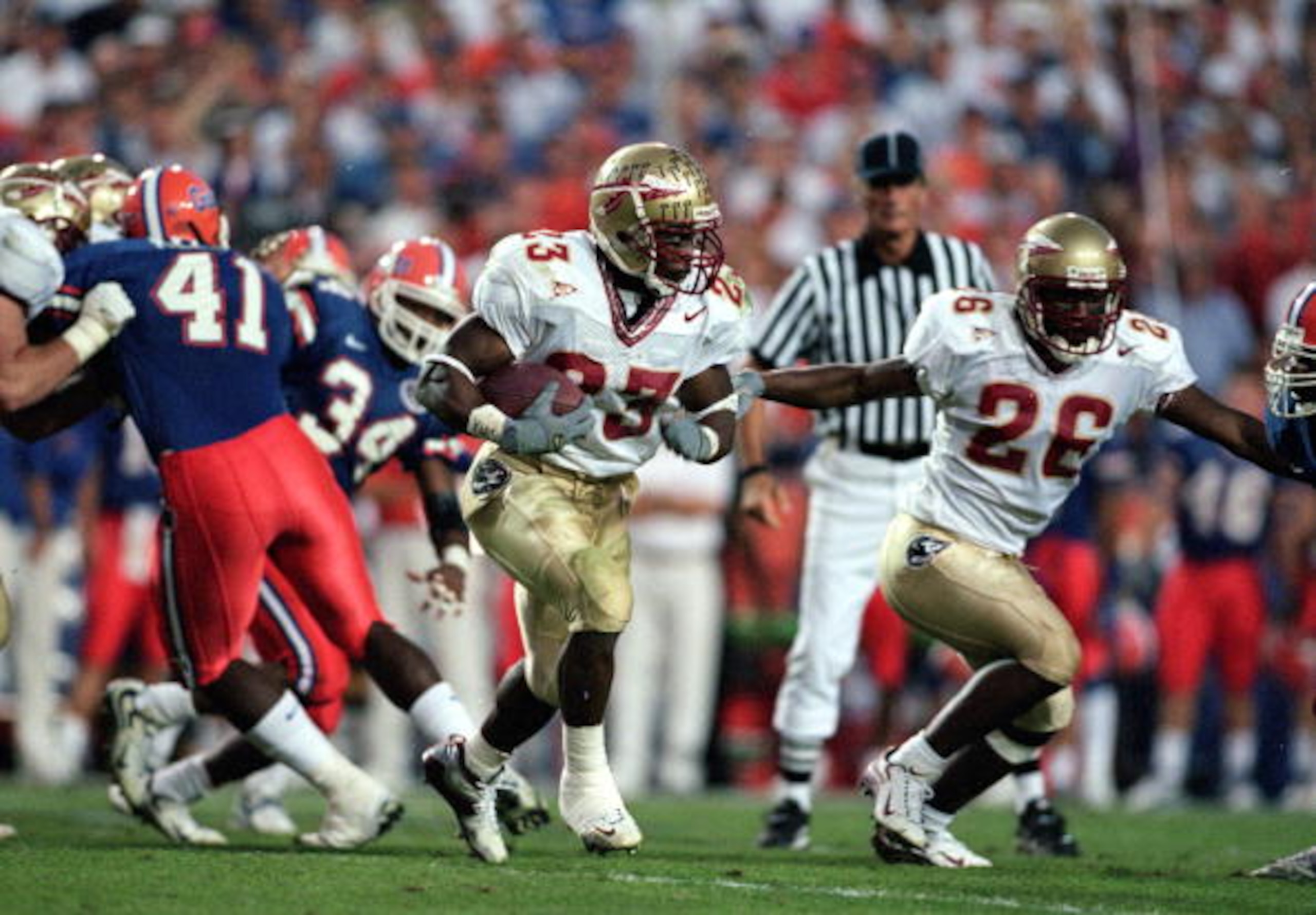 20 Nov 1999: Travis Minor #23 of the Florida State Seminoles runs with the ball during the game against the Florida Gators at the Ben HillGriffin Stadium in Gainsville, Florida. The Seminoles defeated the Gators 23-30.