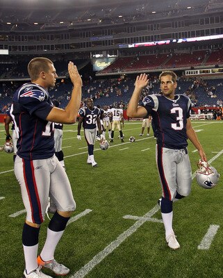 FOXBORO, MA - AUGUST 12: Zoltan Mesko # 14 and Stephen Gostkowski # 3 of the New England Patriots celebrate their 27 - 24 win over the New Orleans Saints at the end of a preseason game at Gillette Stadium on August 12, 2010 in Foxboro, Massachusetts. (Pho