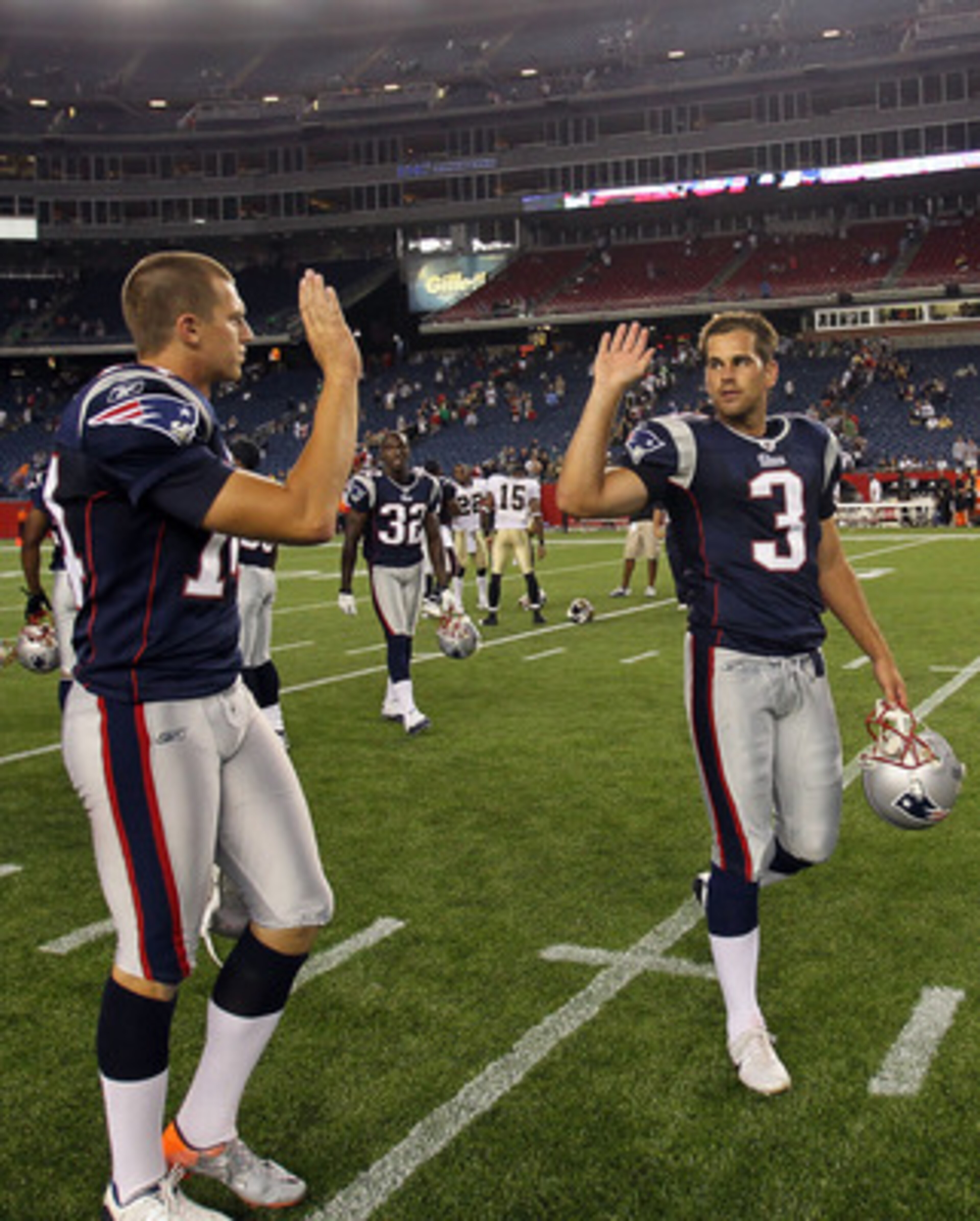 FOXBORO, MA - AUGUST 12: Zoltan Mesko # 14 and Stephen Gostkowski # 3 of the New England Patriots celebrate their 27 - 24 win over the New Orleans Saints at the end of a preseason game at Gillette Stadium on August 12, 2010 in Foxboro, Massachusetts. (Pho