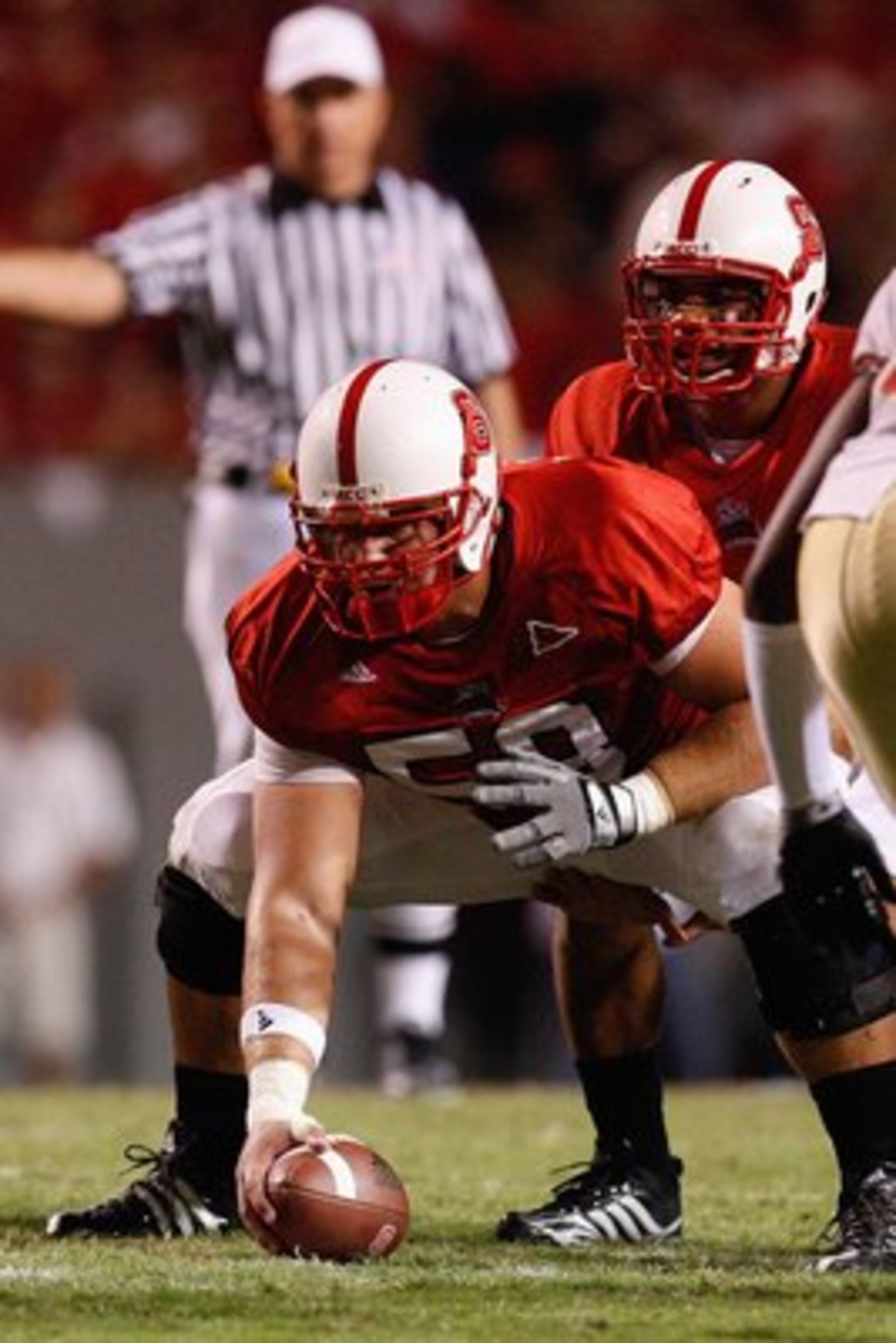 RALEIGH, NC - OCTOBER 16:  Ted Larsen #58 of the North Carolina State Wolfpack prepares to snap the ball to Russell Wilson #16 during the game against the Florida State Seminoles at Carter-Finley Stadium on October 16, 2008 in Raleigh, North Carolina.  (P