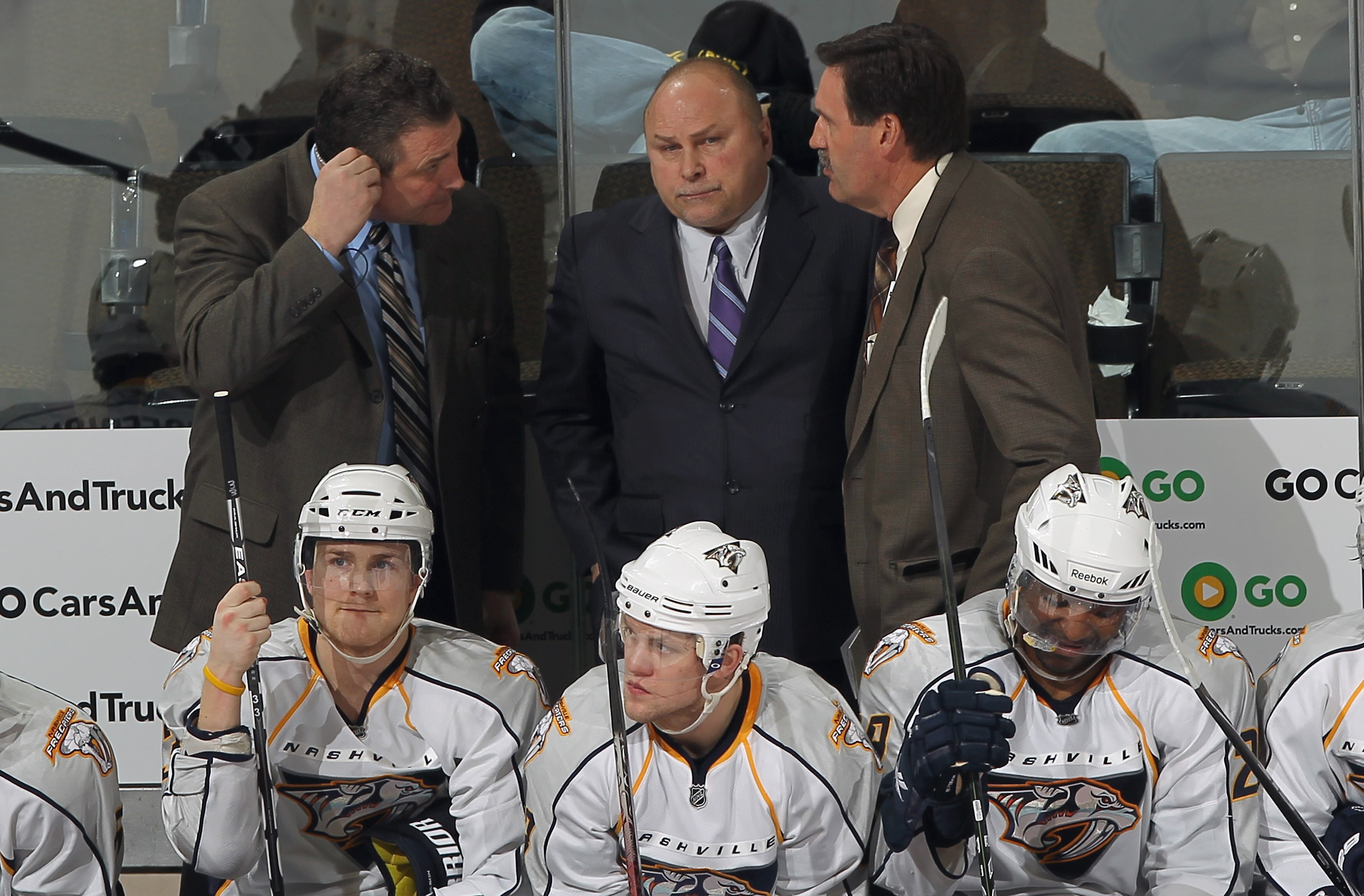DENVER, CO - MARCH 31: Head coach Barry Trotz (C) of the Nashville Predators consults with Assistant Coach Peter Horachek (L) and Associate Coach Brent Peterson (R) against the Colorado Avalanche at the Pepsi Center on March 31, 2011 in Denver, Colorado.
