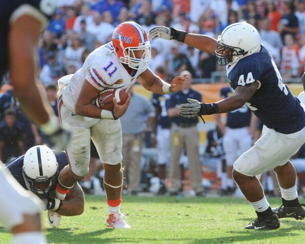 TAMPA, FL - JANUARY 1:  Quarterback Tyler Murphy #11 of the Florida Gators runs upfield for gain against the Penn State Nittany Lions January 1, 2011 in the 25th Outback Bowl at Raymond James Stadium in Tampa, Florida.  (Photo by Al Messerschmidt/Getty Im