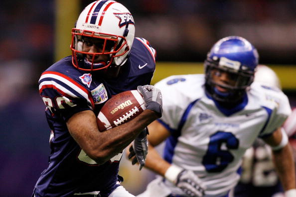 NEW ORLEANS - DECEMBER 21: Lester Jean #80 of the Florida Atlantic University Owls avoids a tackle by Dontae Reed #6 of the Memphis University Tigers in the New Orleans Bowl on December 21, 2007 at the Louisiana Superdome in New Orleans, Louisiana. The NEW ORLEANS - DECEMBER 21: Lester Jean #80 of the Florida Atlantic University Owls avoids a tackle by Dontae Reed #6 of the Memphis University Tigers in the New Orleans Bowl on December 21, 2007 at the Louisiana Superdome in New Orleans, Louisiana. The