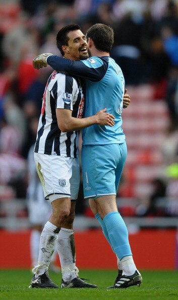 SUNDERLAND, ENGLAND - APRIL 09: Paul Scharner and Scott Carson of West Bromwich Albion celebrate on the final whistle during the Barclays Premier League match between Sunderland and West Bromwich Albion at The Stadium of Light on April 9, 2011 in Sunderla