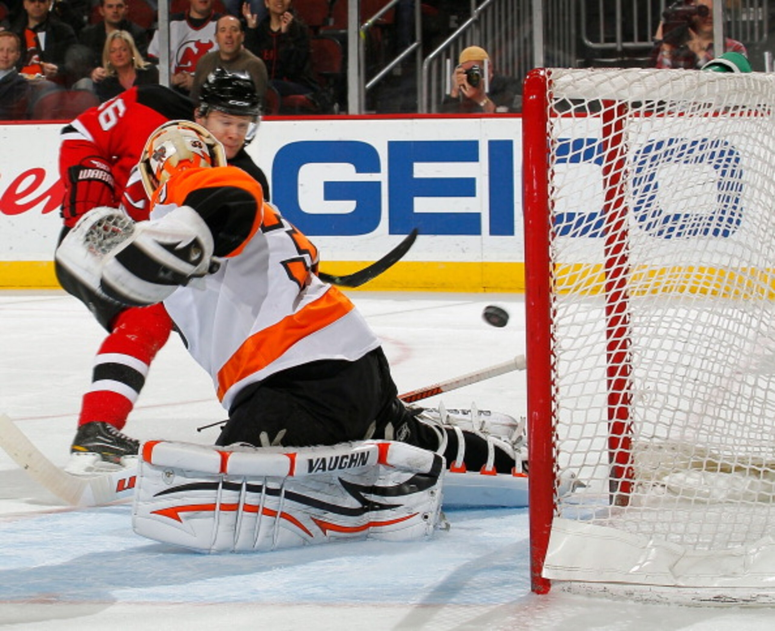 NEWARK, NJ - APRIL 01:  Goalie Brian Boucher #33 of the Philadelphia Flyers misses this shot by Patrik Elias #26 of the New Jersey Devils for his second goal of the night during the second period of an NHL hockey game at the Prudential Center on April 1,