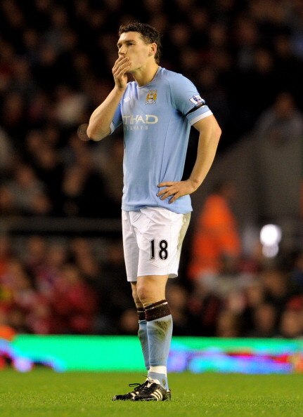 LIVERPOOL, ENGLAND - APRIL 11:  Gareth Barry of Manchester City looks dejected during the Barclays Premier League match between Liverpool and Manchester City at Anfield on April 11, 2011 in Liverpool, England.  (Photo by Michael Regan/Getty Images)