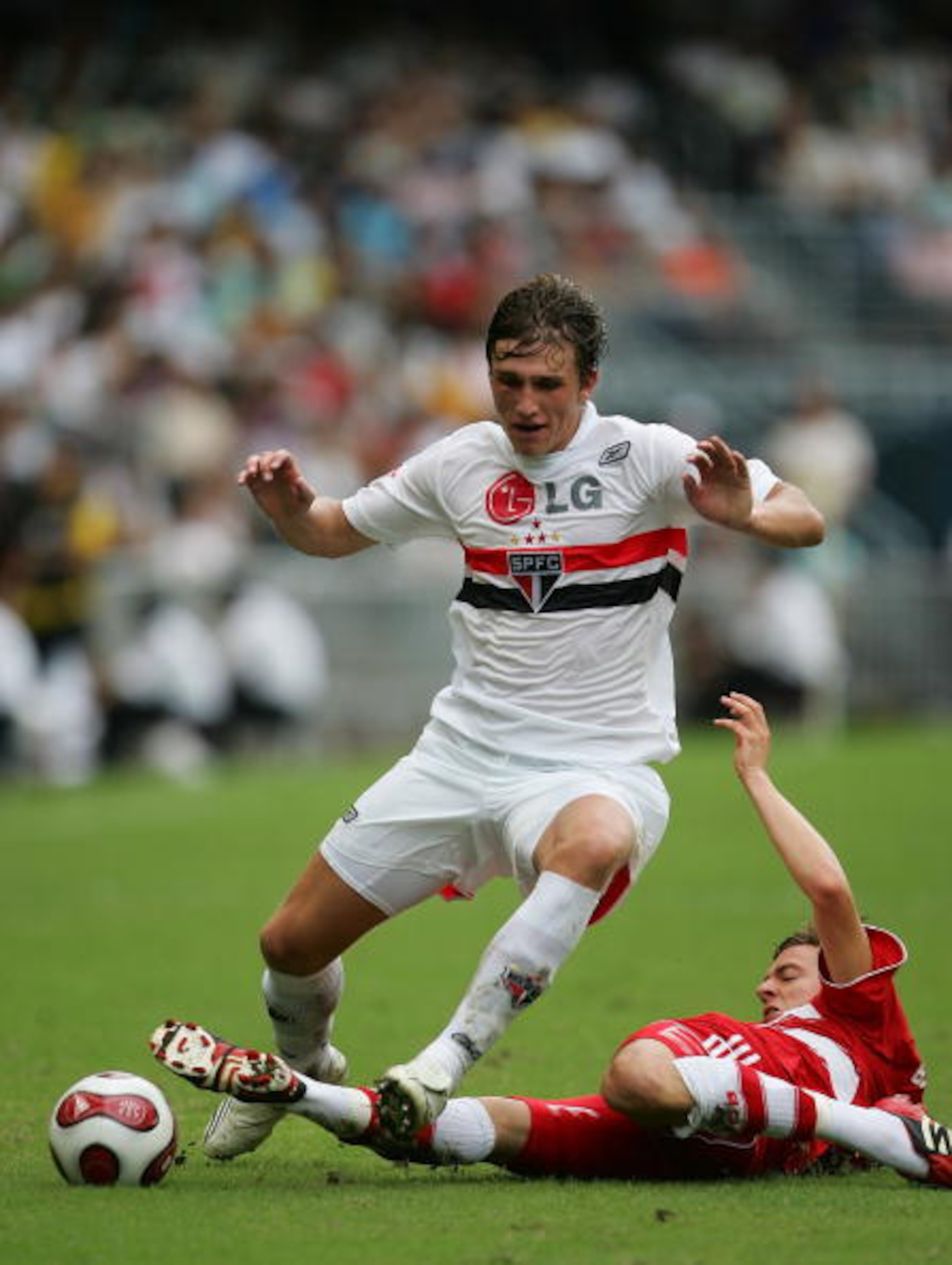 HONG KONG - JULY 01: Aislan (L) of Sao Paul FC and Sandro Wagner of Bayern Munich fight for the ball during the Bayern Munich vs Sao Paulo FC match of the HKSAR 10th Anniversary Reunification Cup at Hong Kong Stadium on July 1, 2008 in Hong Kong, China.