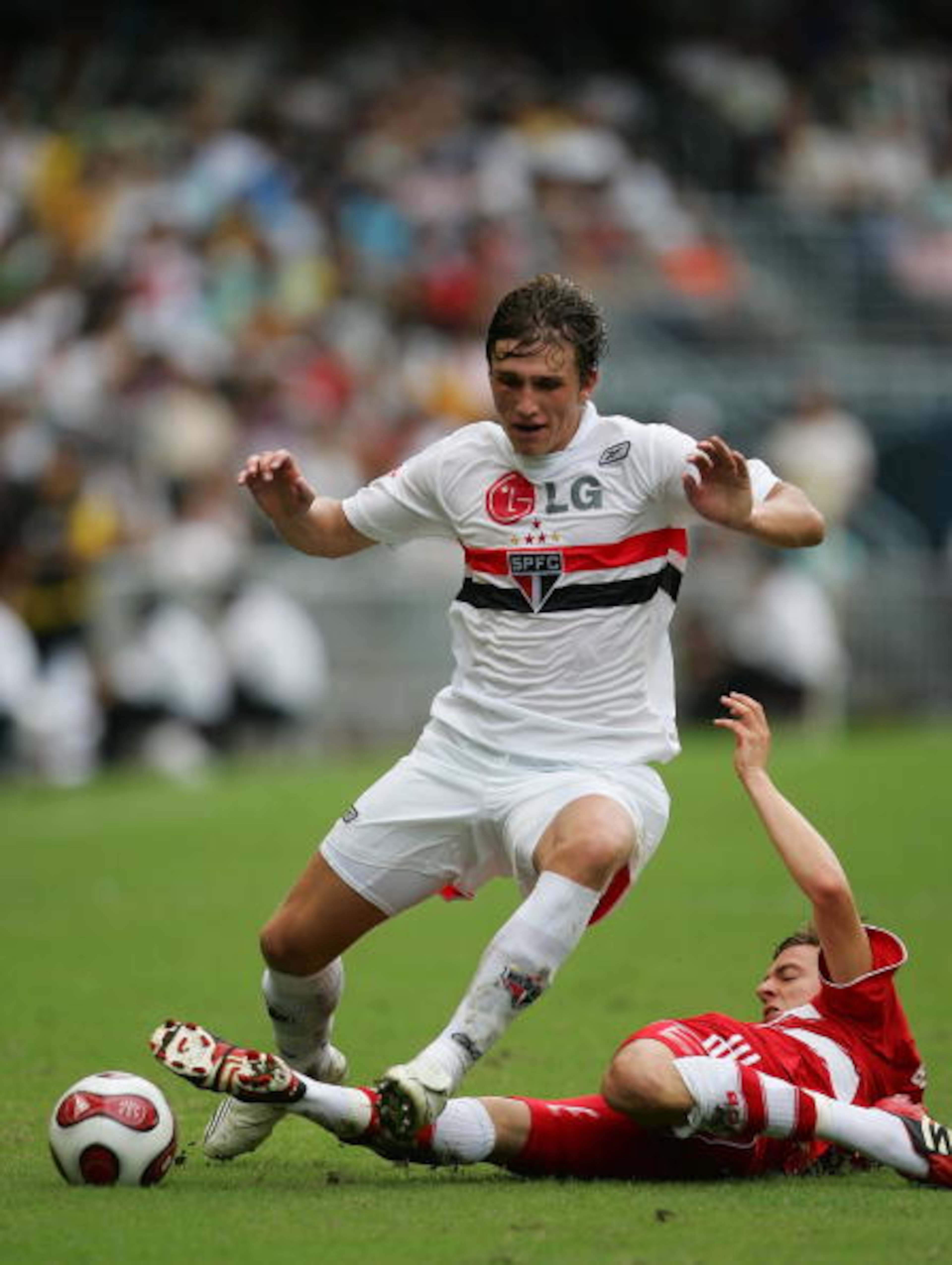 HONG KONG - JULY 01: Aislan (L) of Sao Paul FC and Sandro Wagner of Bayern Munich fight for the ball during the Bayern Munich vs Sao Paulo FC match of the HKSAR 10th Anniversary Reunification Cup at Hong Kong Stadium on July 1, 2008 in Hong Kong, China. HONG KONG - JULY 01: Aislan (L) of Sao Paul FC and Sandro Wagner of Bayern Munich fight for the ball during the Bayern Munich vs Sao Paulo FC match of the HKSAR 10th Anniversary Reunification Cup at Hong Kong Stadium on July 1, 2008 in Hong Kong, China.