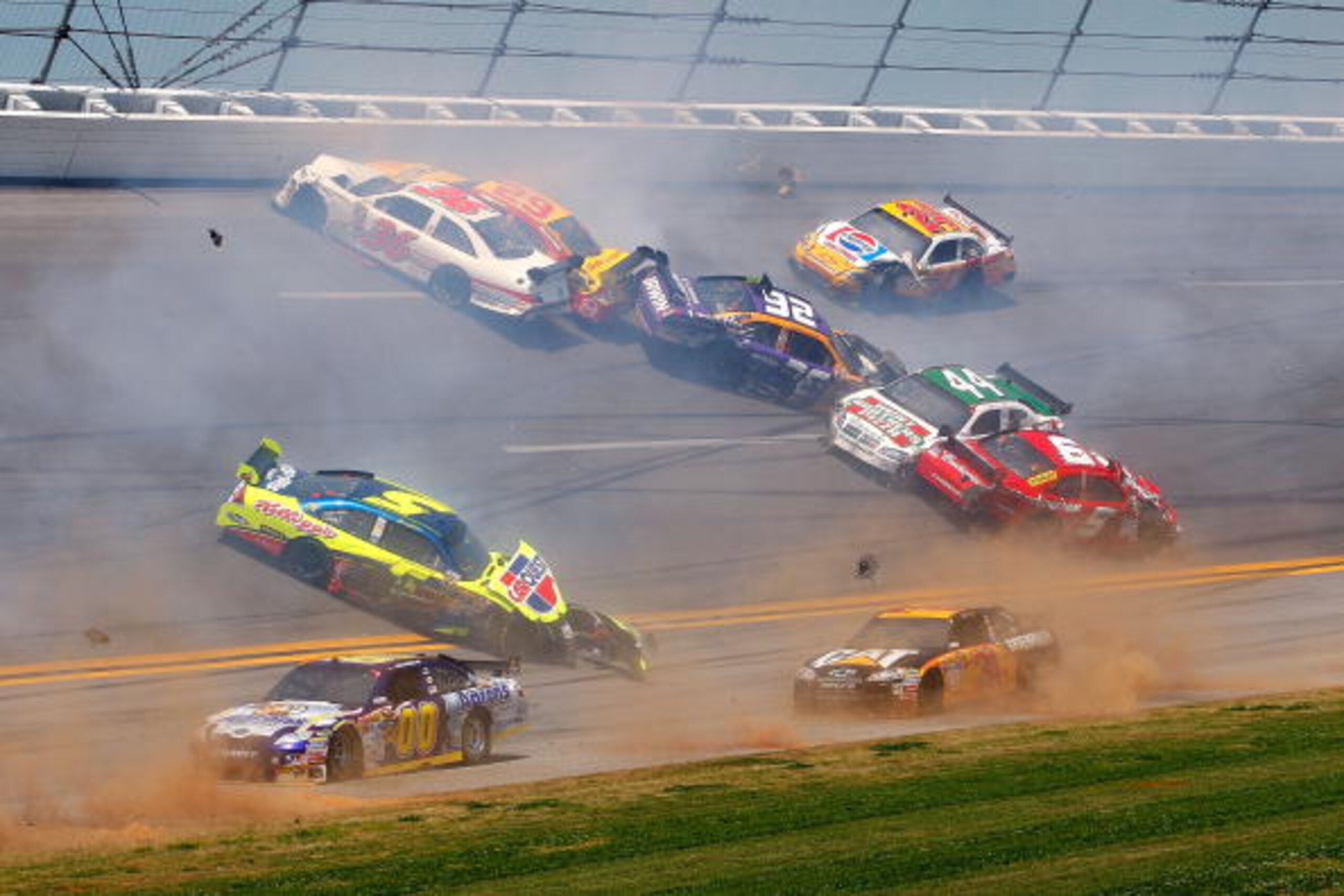 TALLADEGA, AL - APRIL 26:  Mark Martin, driver of the #5 Carquest/Kellogg's Chevrolet, AJ Allmendinger, driver of the #44 Richard Petty Motorsports Dodge, David Reutimann, driver of the #00 Aaron's Dream Machine Toyota, Jeff Burton, driver of the #31 Cate