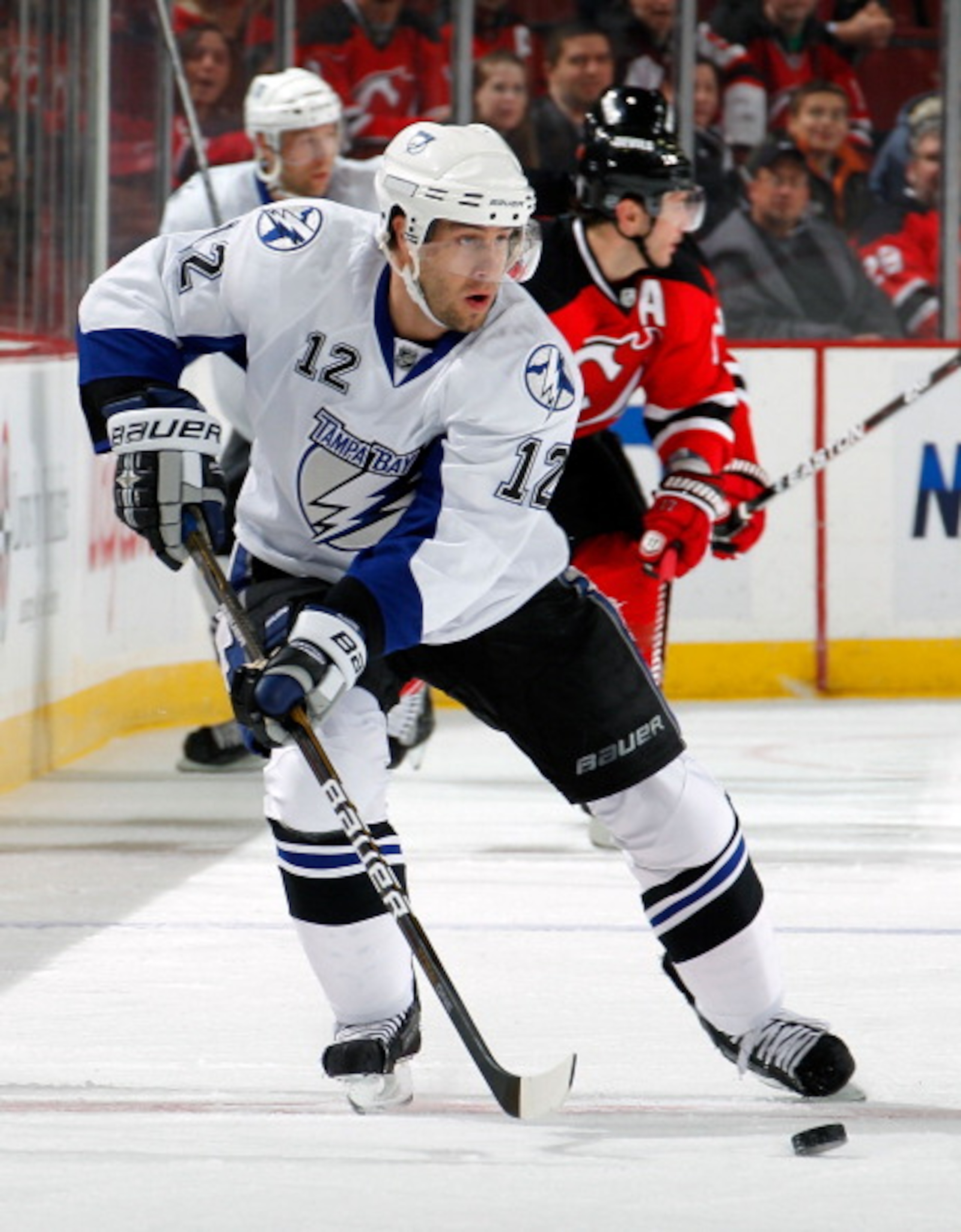 NEWARK, NJ - MARCH 02:  Simon Gagne #12 of the Tampa Bay Lightning skates during an NHL hockey game against the New Jersey Devils at the Prudential Center on March 2, 2011 in Newark, New Jersey.  (Photo by Paul Bereswill/Getty Images)